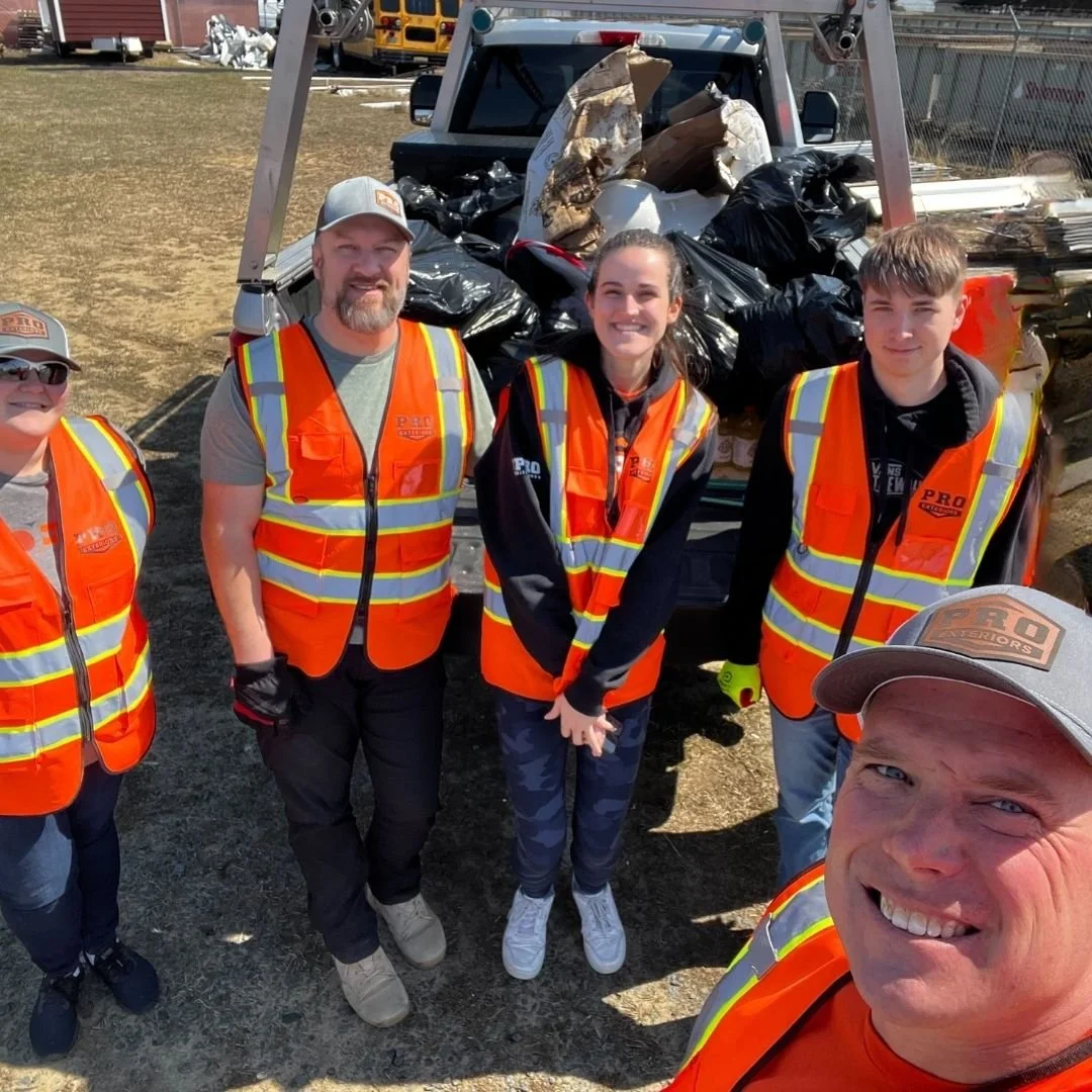 A selfie of the Pro Exteriors team during a 2025 cleanup of our stretch of highway as part of the adopt a highway program