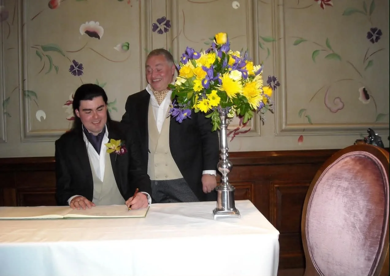 LGBTQ+ wedding celebrant officiating a personalised ceremony for two grooms in Buckinghamshire.