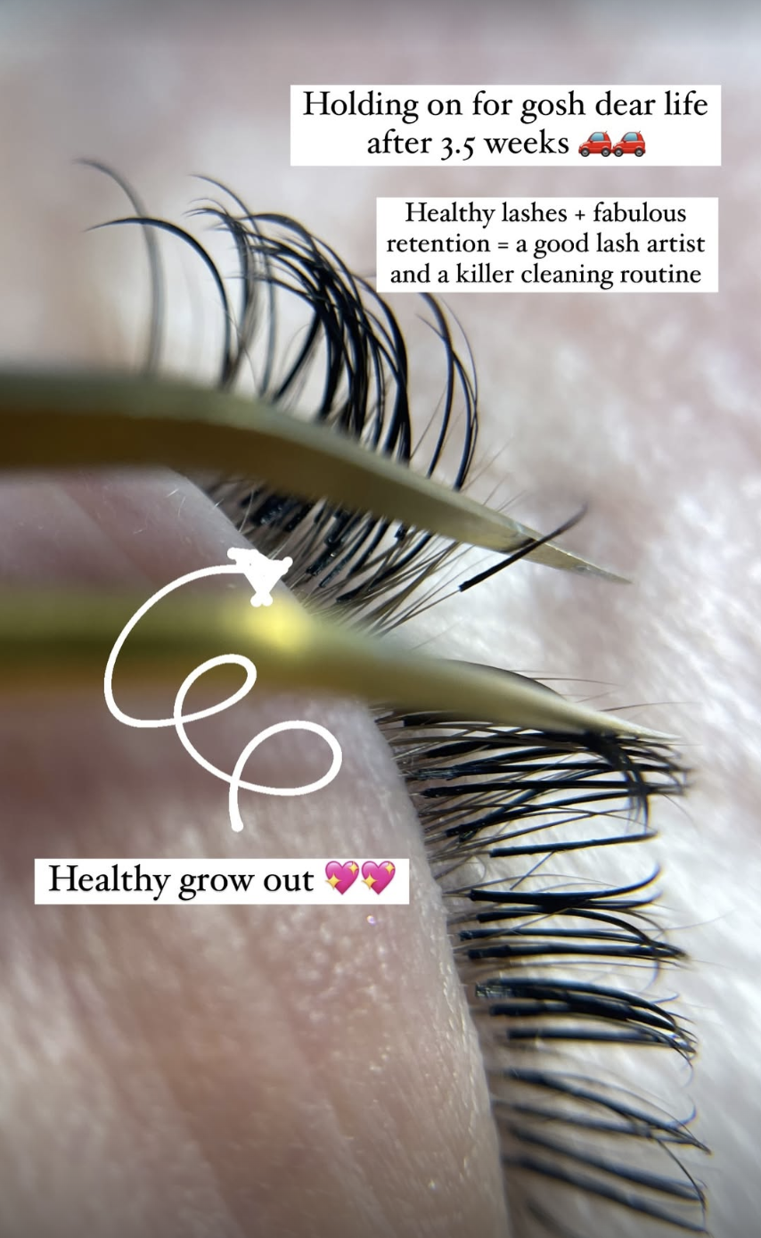 Close-up of a person's eyelash extension application with text overlay: "Holding on for gosh dear life after 3.5 weeks," and "Healthy lashes + fabulous retention = a good lash artist and a killer cleaning routine," with a small graphic of a lint roller near the eyelashes, and another text overlay: "Healthy grow out" with heart emojis.