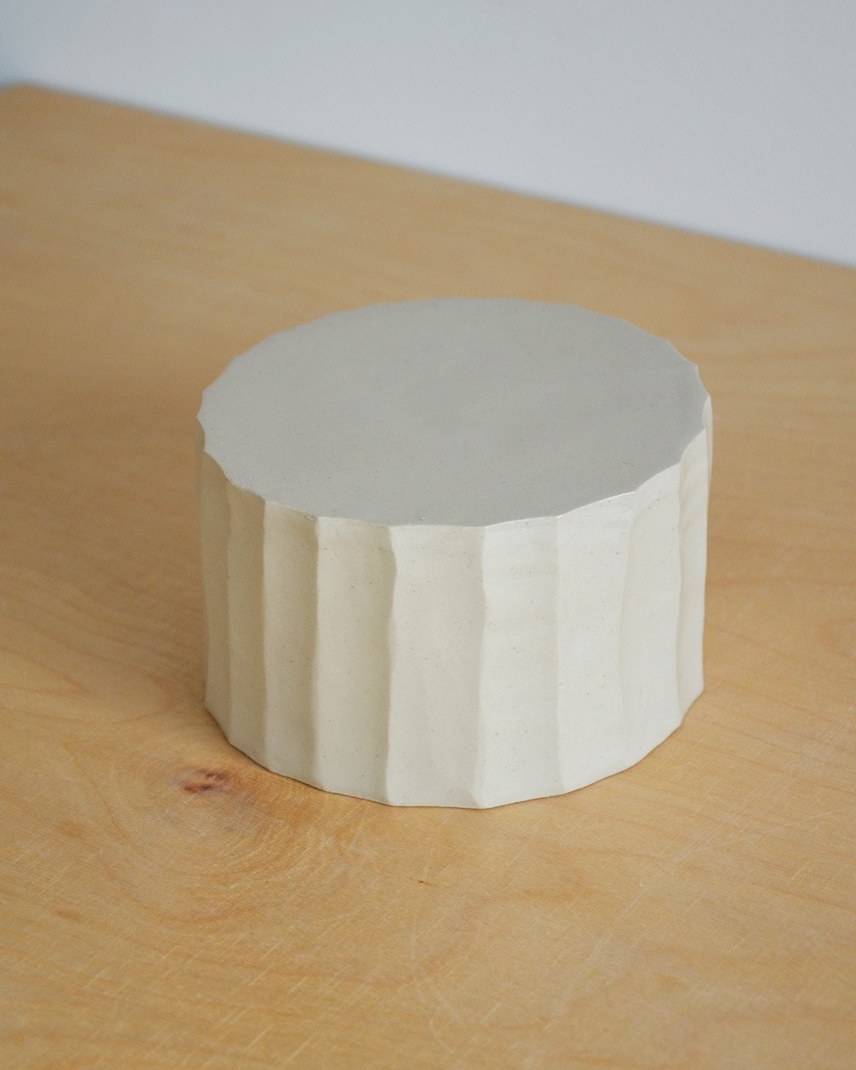 Cream-white ceramic serving dish with a textured edge and a unique design—perfect for everyday use or for special occasions.