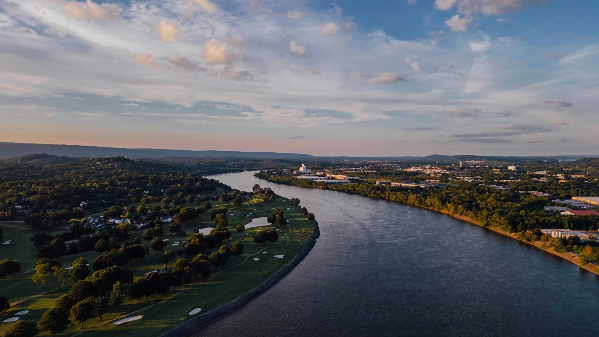 Aerial view of the Tennessee River winding through the greater Chattanooga metro area, representing the primary service region for Anderson Gutter & Tree