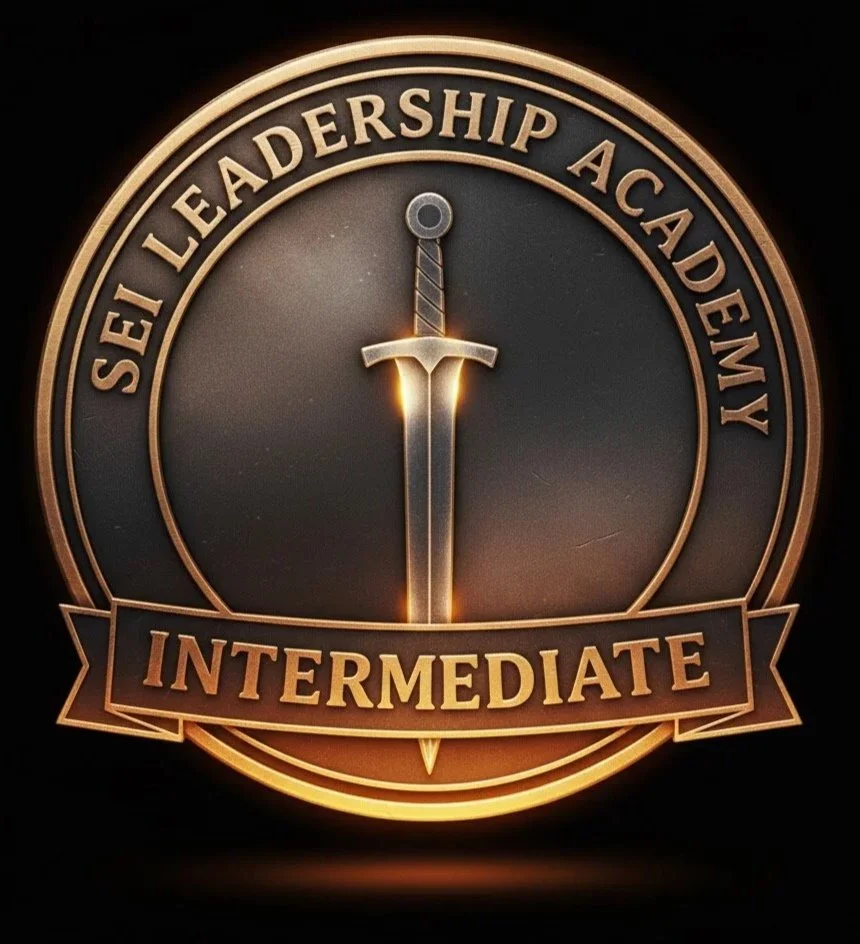 A circular emblem with a sword in the center, surrounded by the text 'Set Leadership Academy' at the top and a banner at the bottom with the word 'Intermediate.'