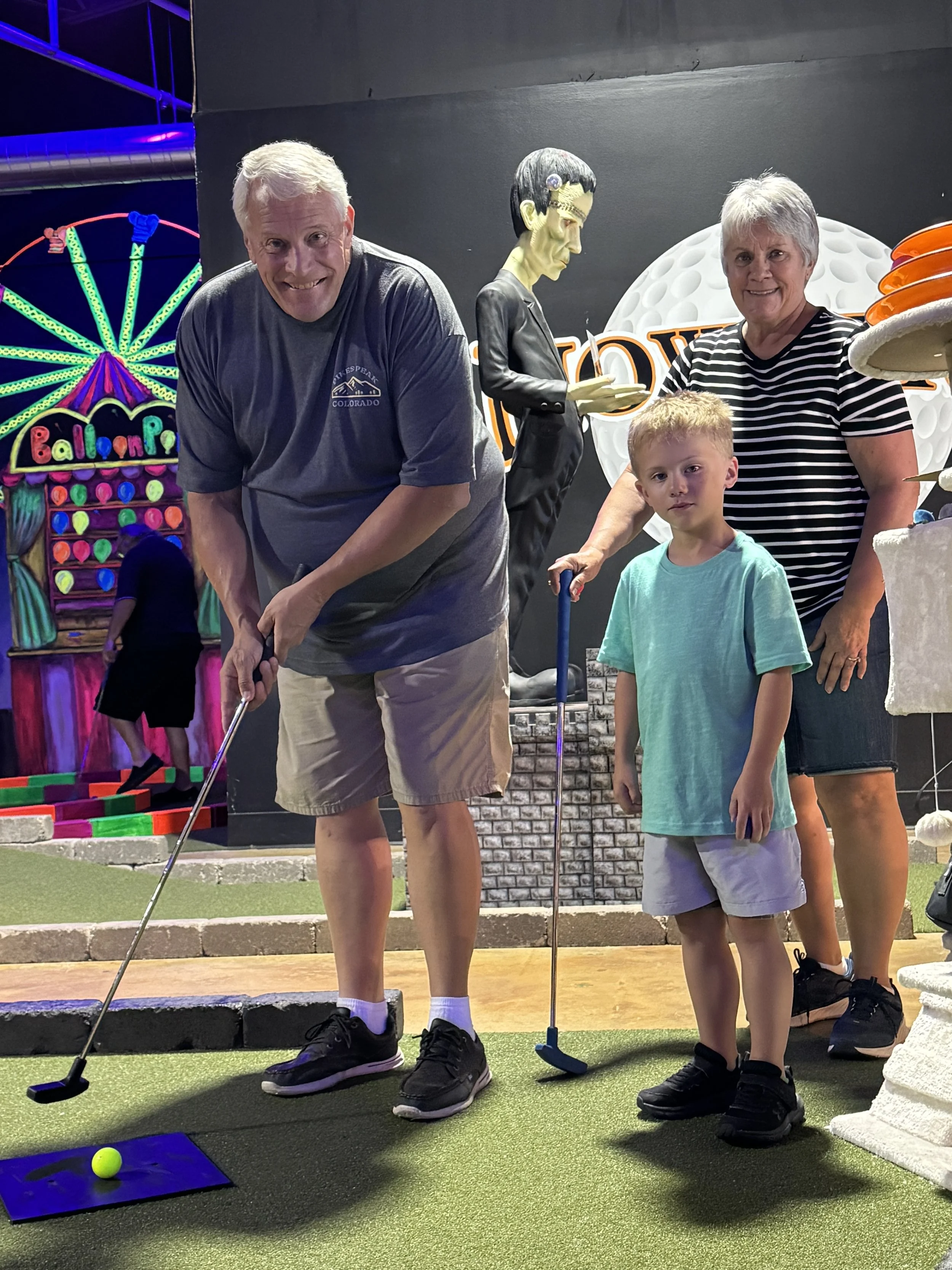 FamilyPlayingMiniGolf.JPG