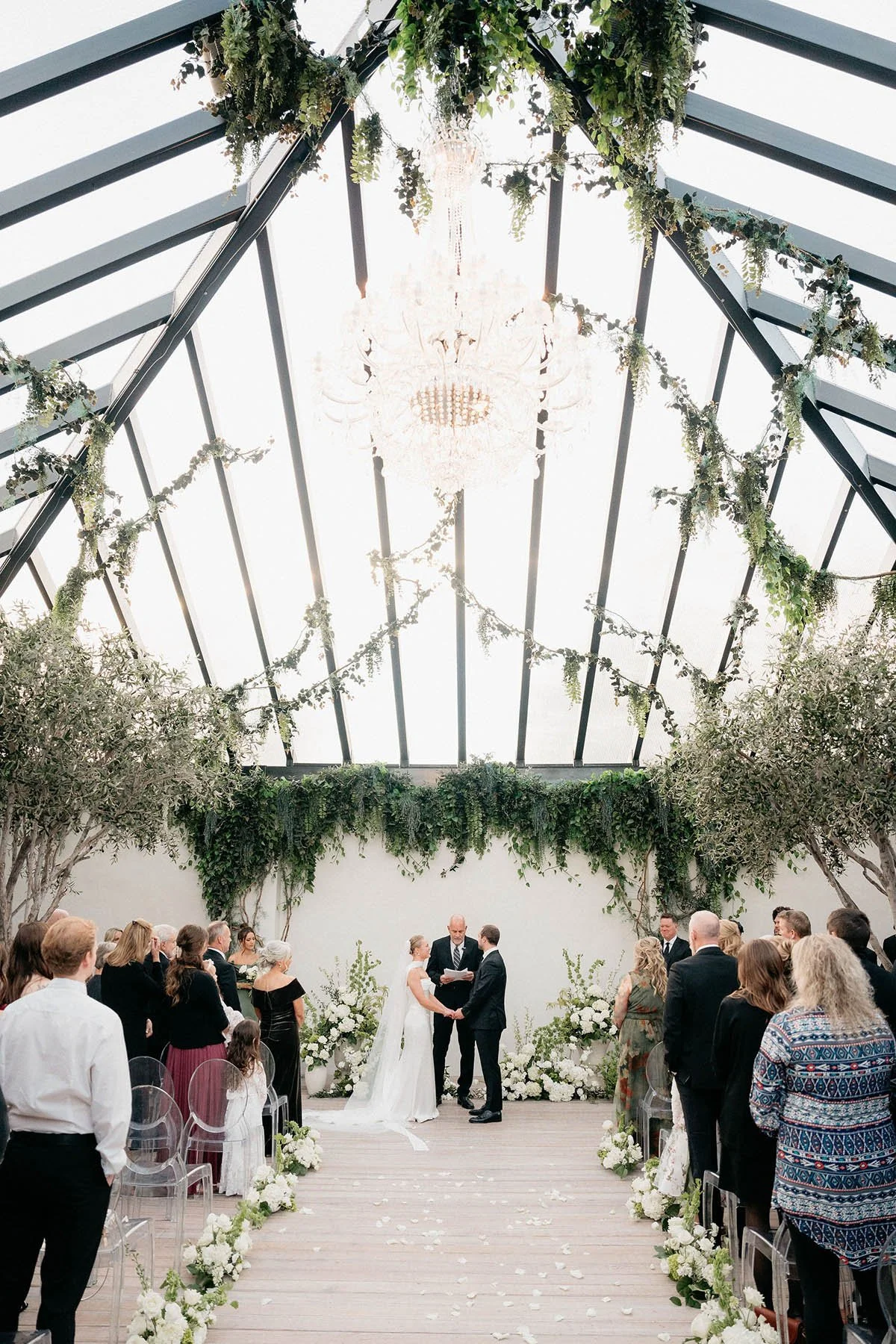 vertical-ceremony-photo-greenhouse-two-rivers-white-green-floral-installation.JPG