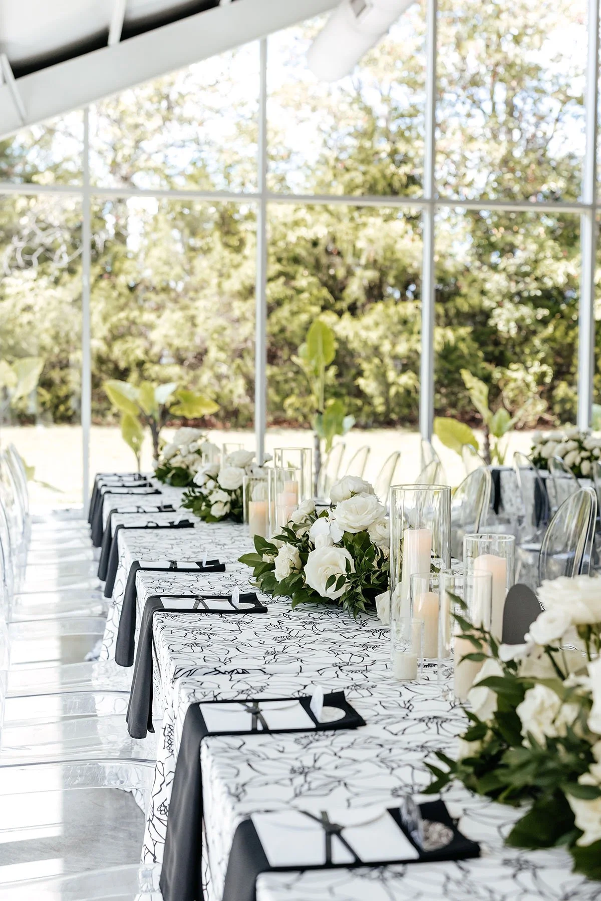 looking-down-family-style-table-white-floral-linens-linear-centerpieces.JPG