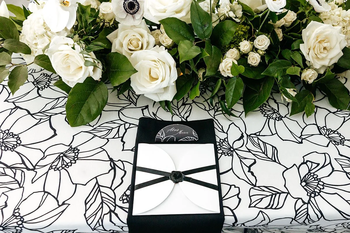 sealed-menue-on-floral-linens-white-centerpiece.JPG