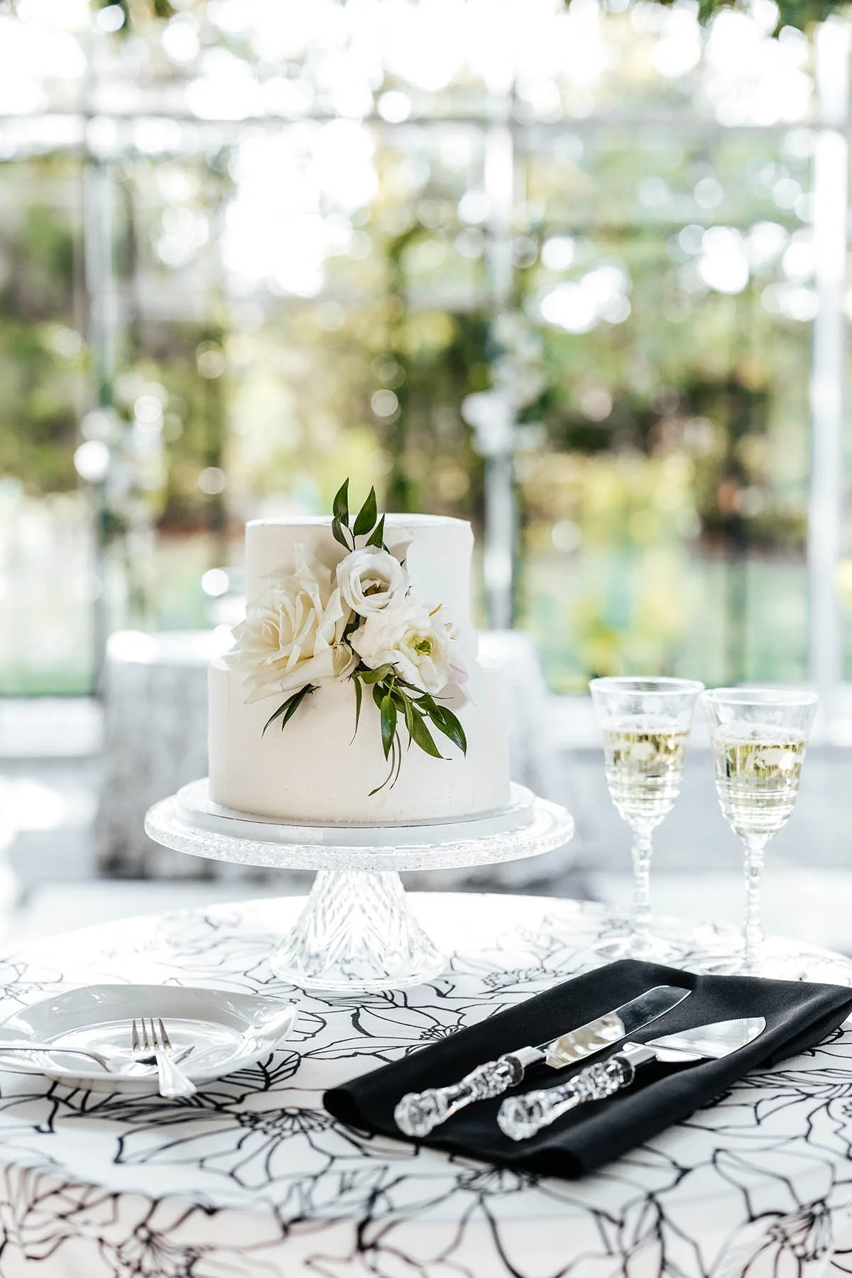 two-tier-cake-white-florals-black-napkin.JPG