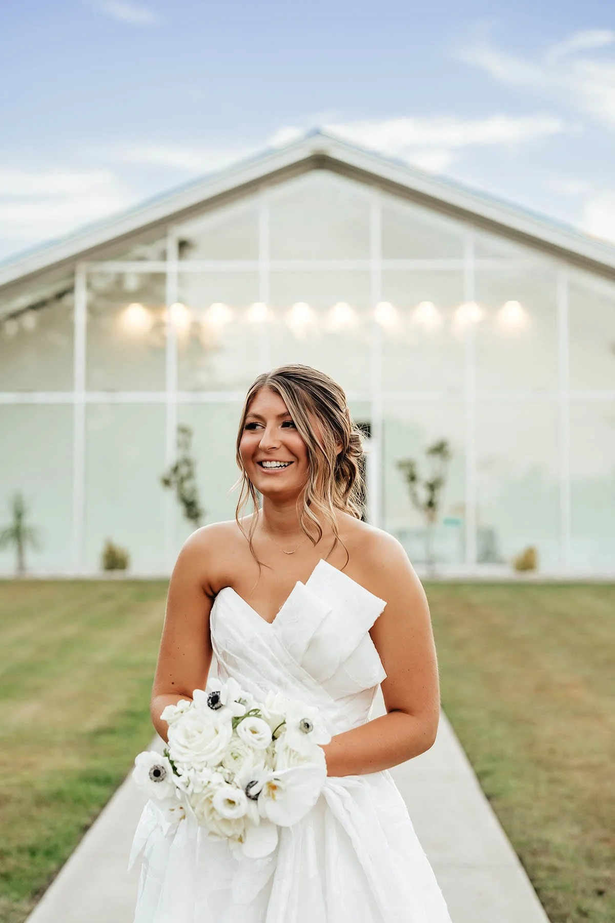 bride-white-bouquet-roses-orchids-lisianthus.JPG