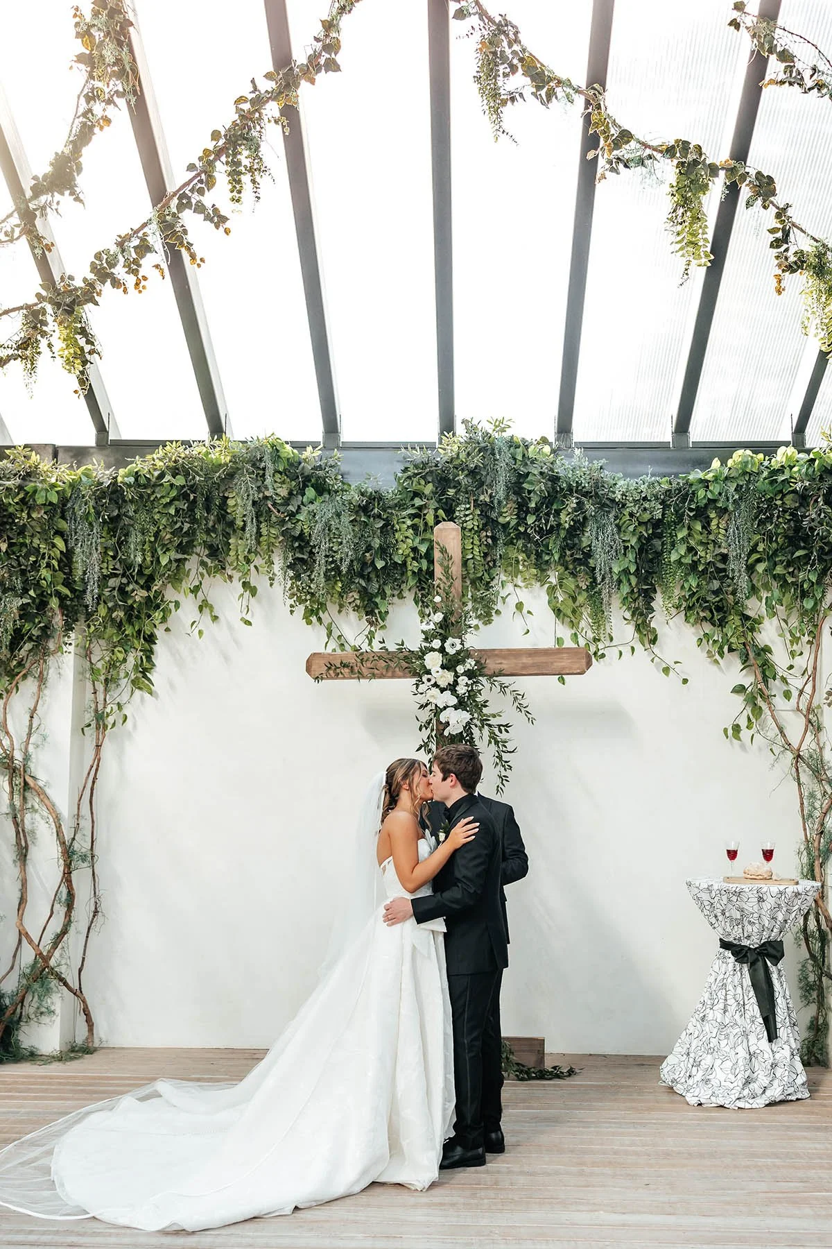 first-kiss-newlyweds-greenhouse-two-rivers.JPG