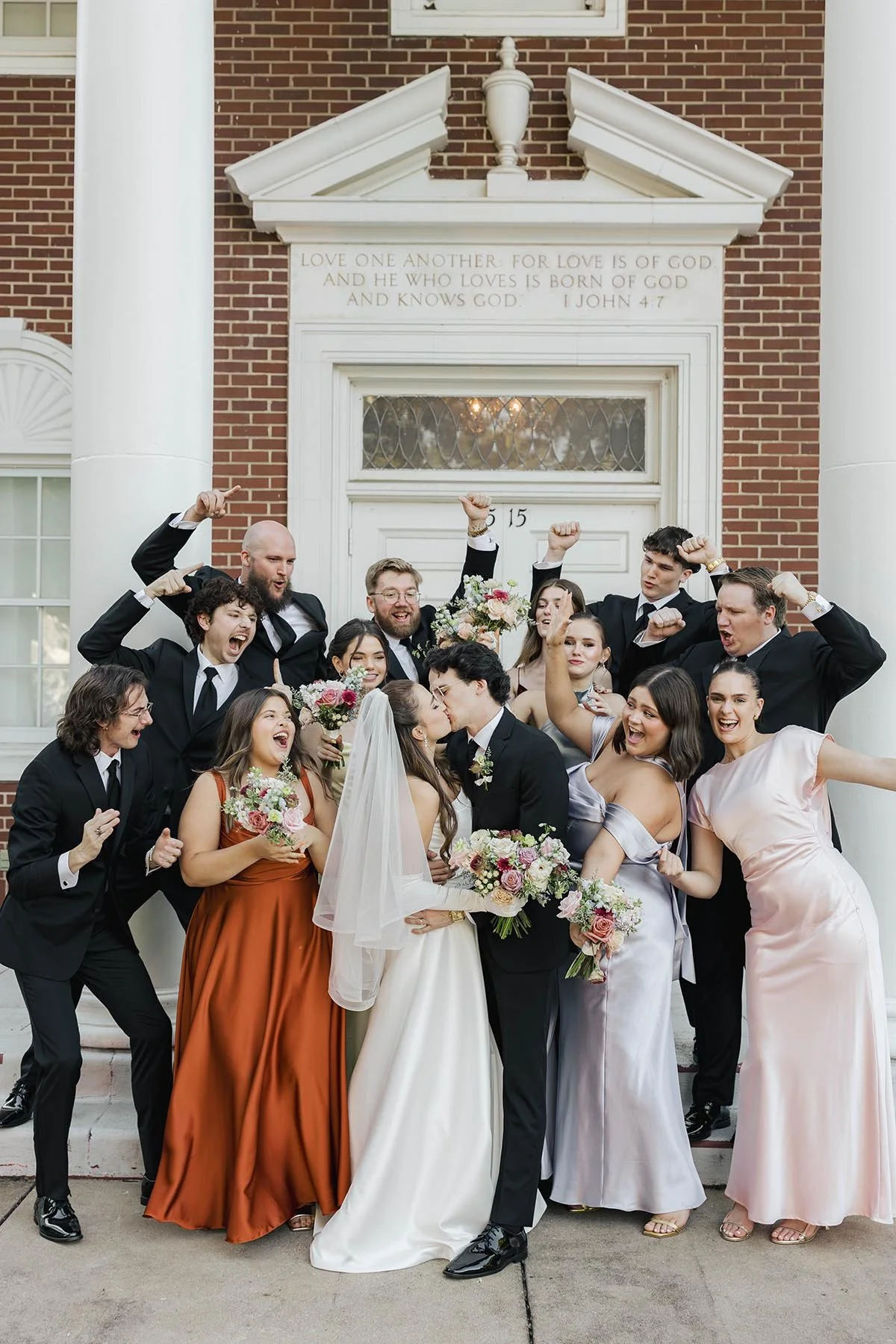 wedding-party-in-front-of-church-with-colorful-muted-bouquets.JPG