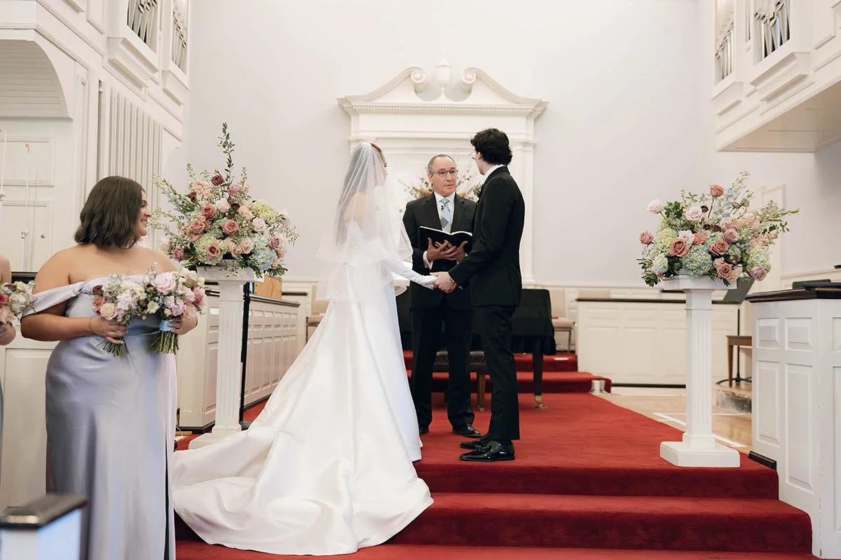 ceremony with red carpet-colorful-muted-florals.JPG