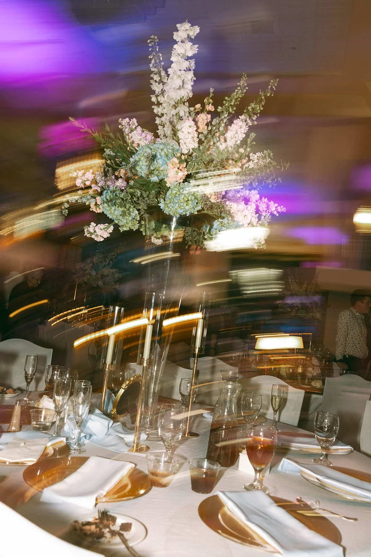 twirly-motion-pic-of-tall-colorful-centerpieces.JPG