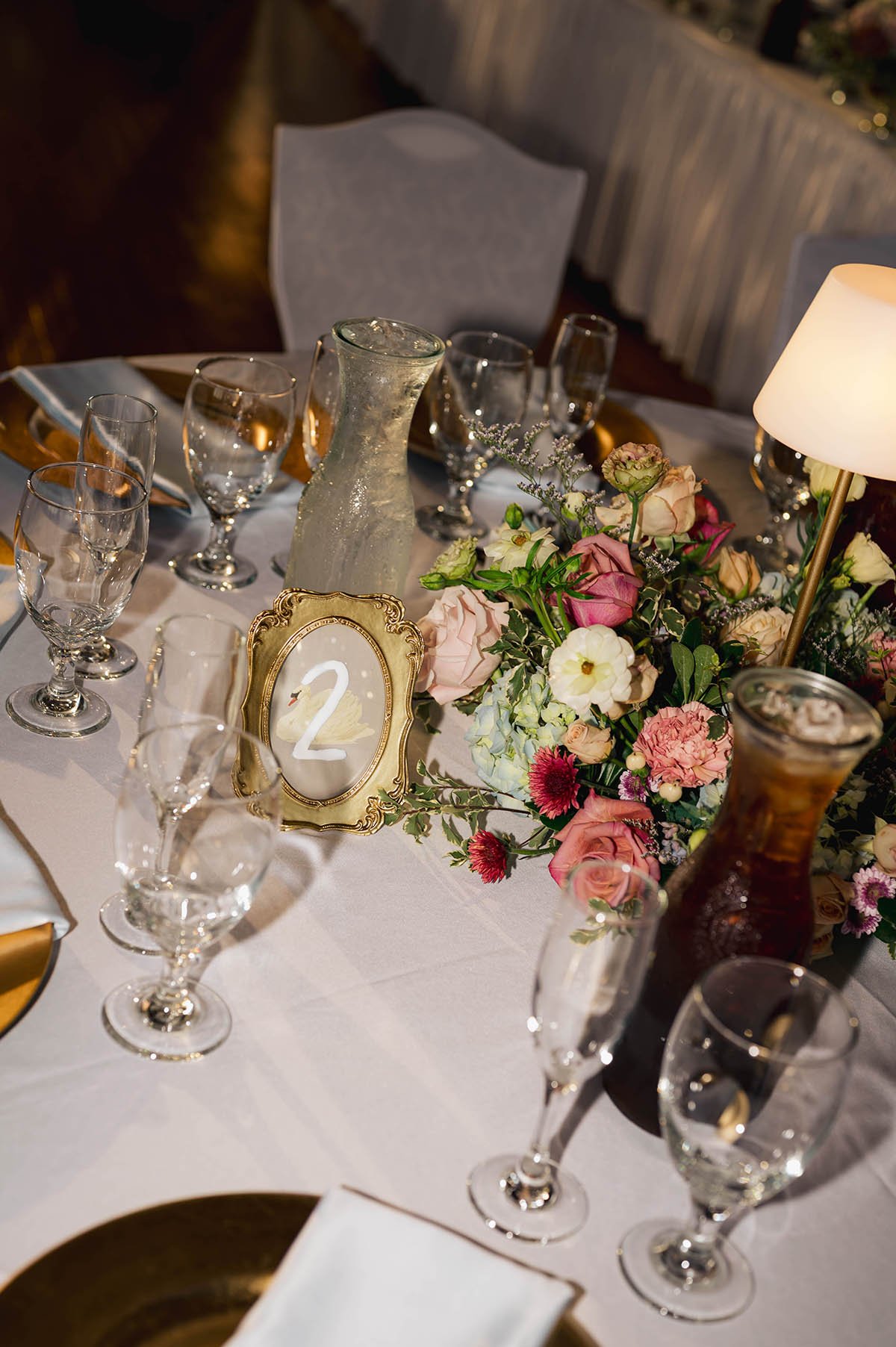 centerpiece-with-colorful-muted-flowers-and-lamp-ambiance.JPG