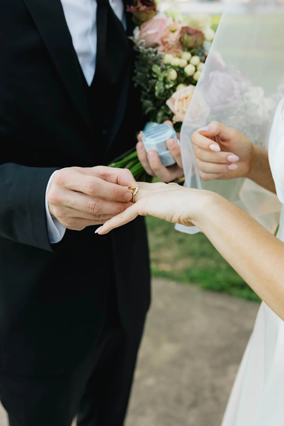 ring-exchange-groom-holding-bouquet.JPG