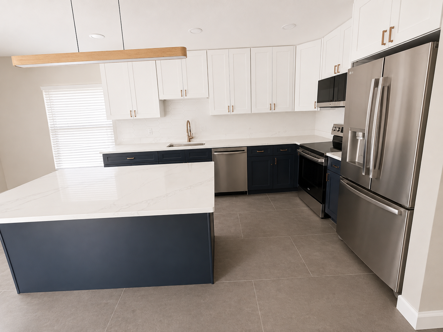 Brand new kitchen with stainless steel appliances, quartz countertops and ample cabinet storage.