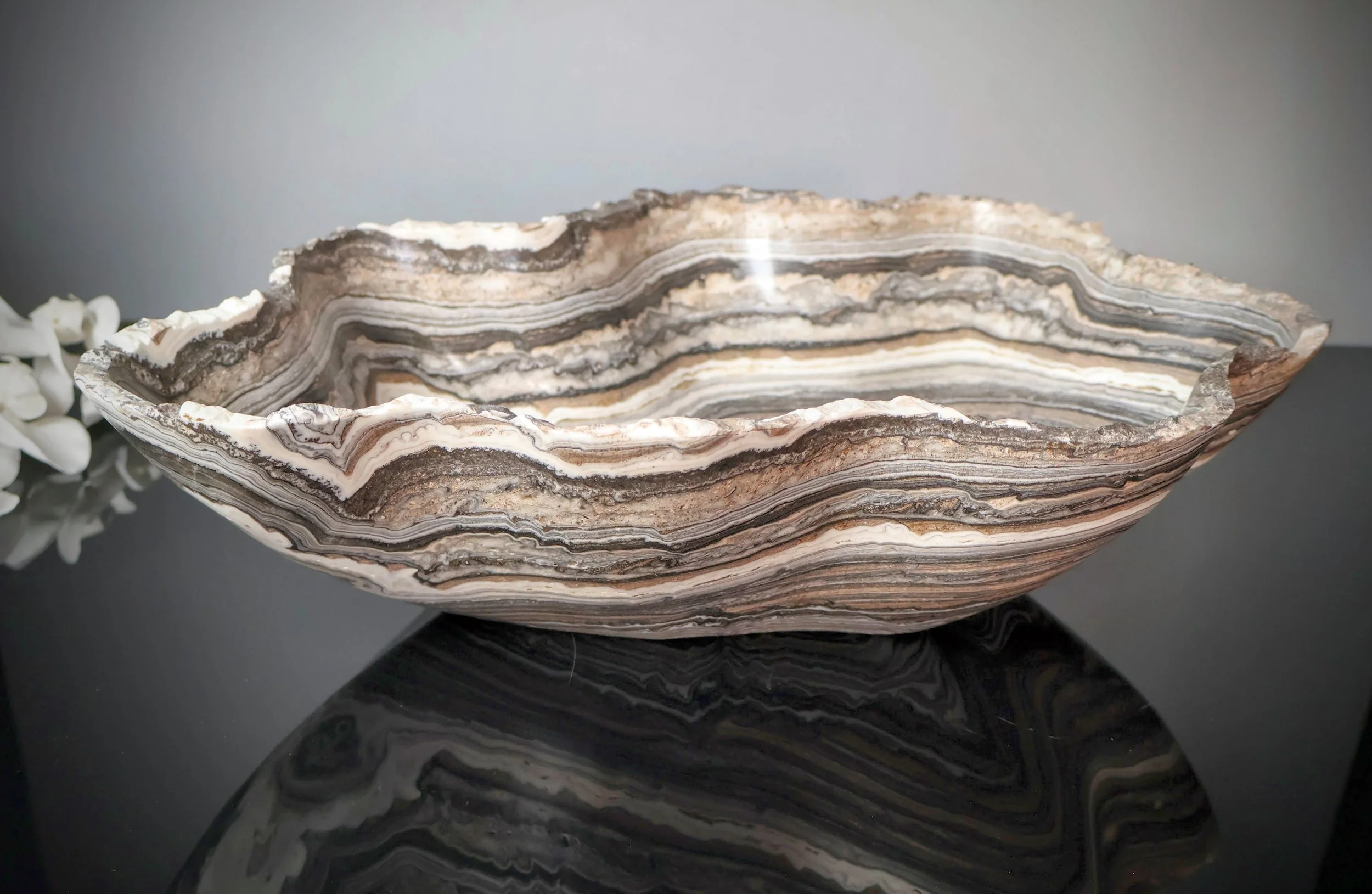 side view of large onyx bowl with zebra banding