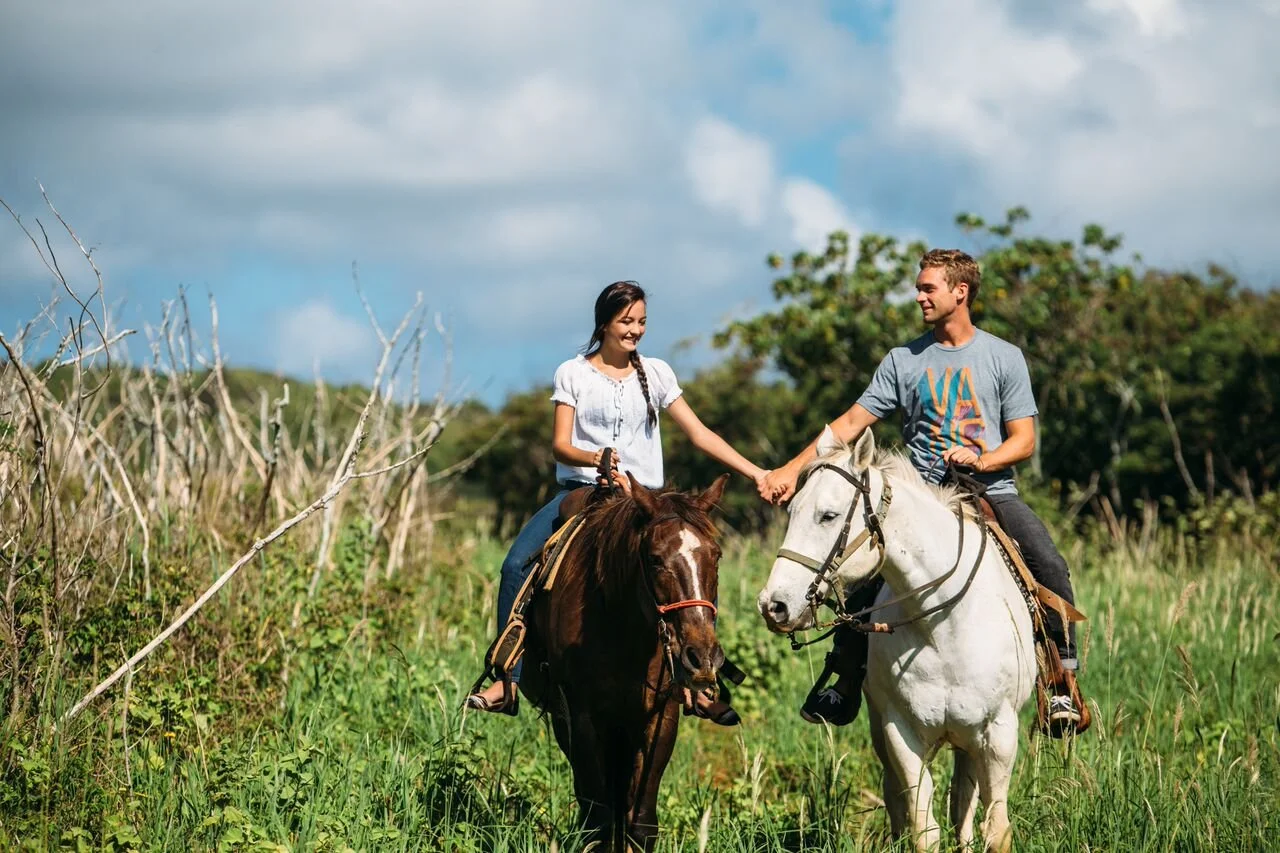 two people riding on horseback