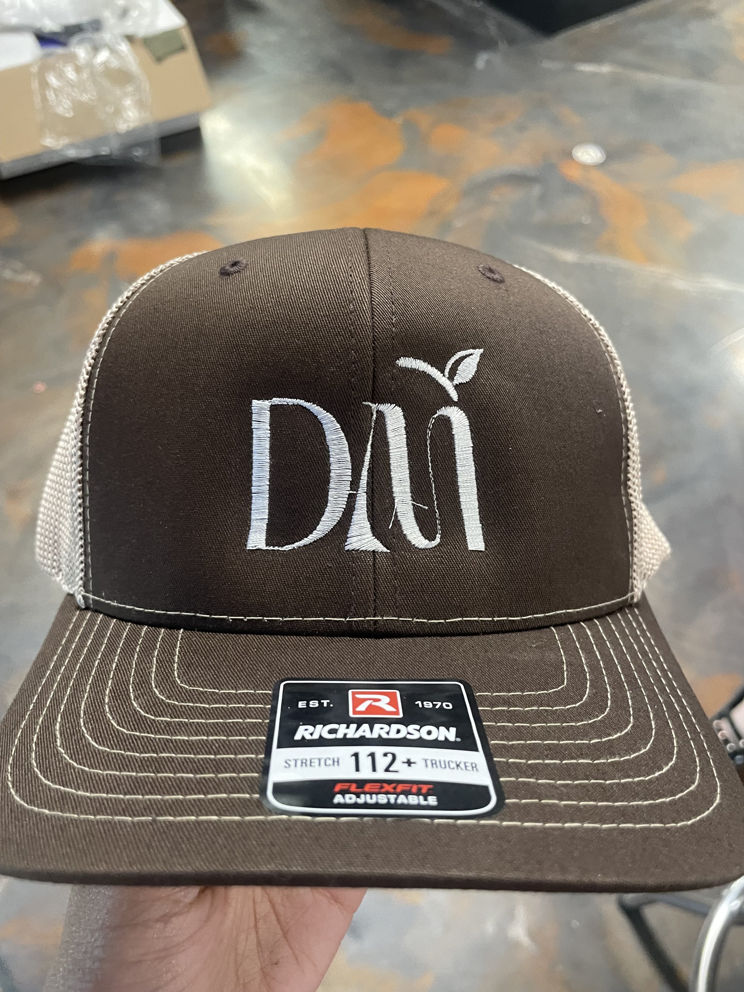 DM LOGO TRUCKER HAT