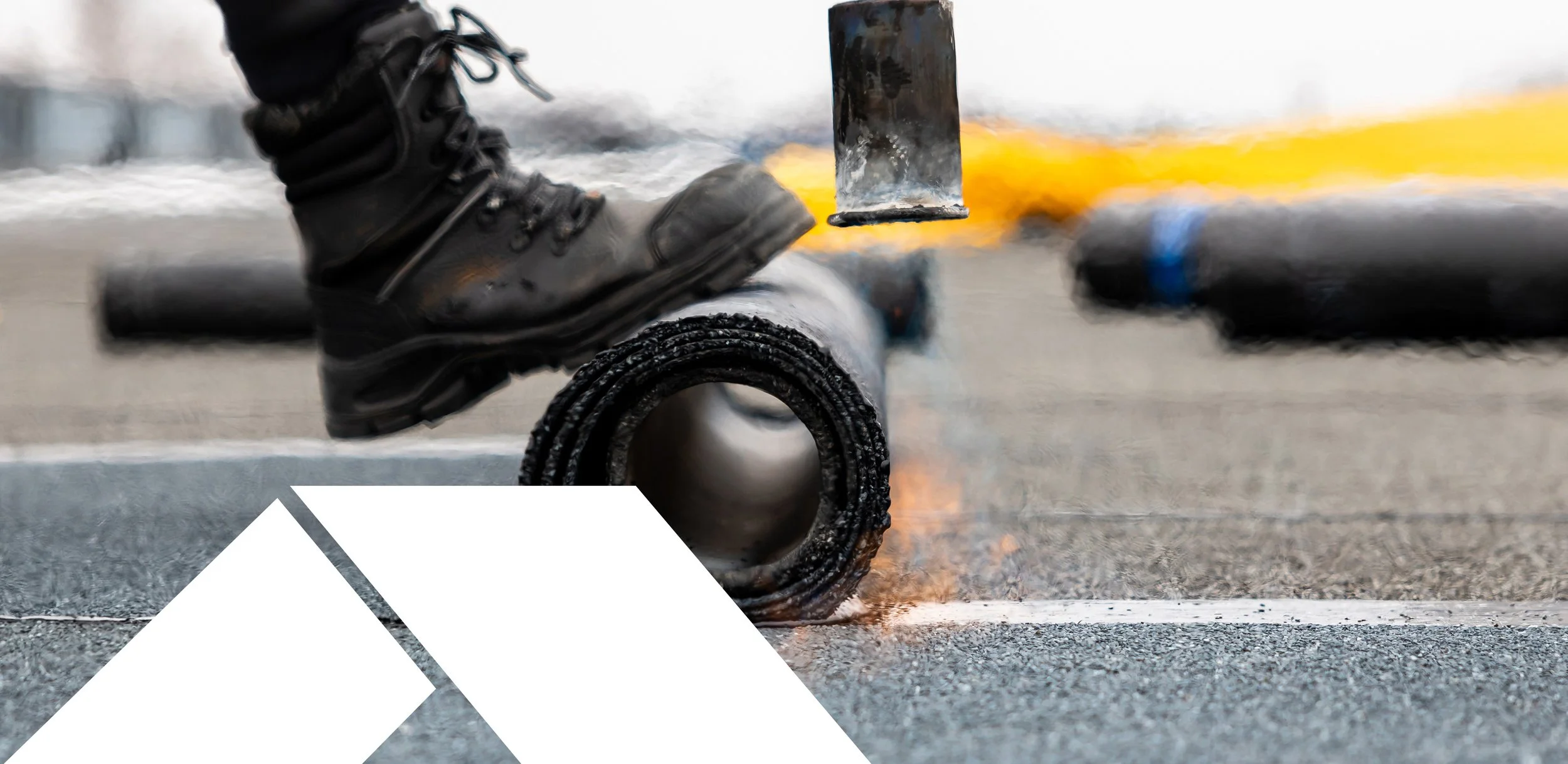 Welder wearing black work boots welding a metal pipe with bright sparks