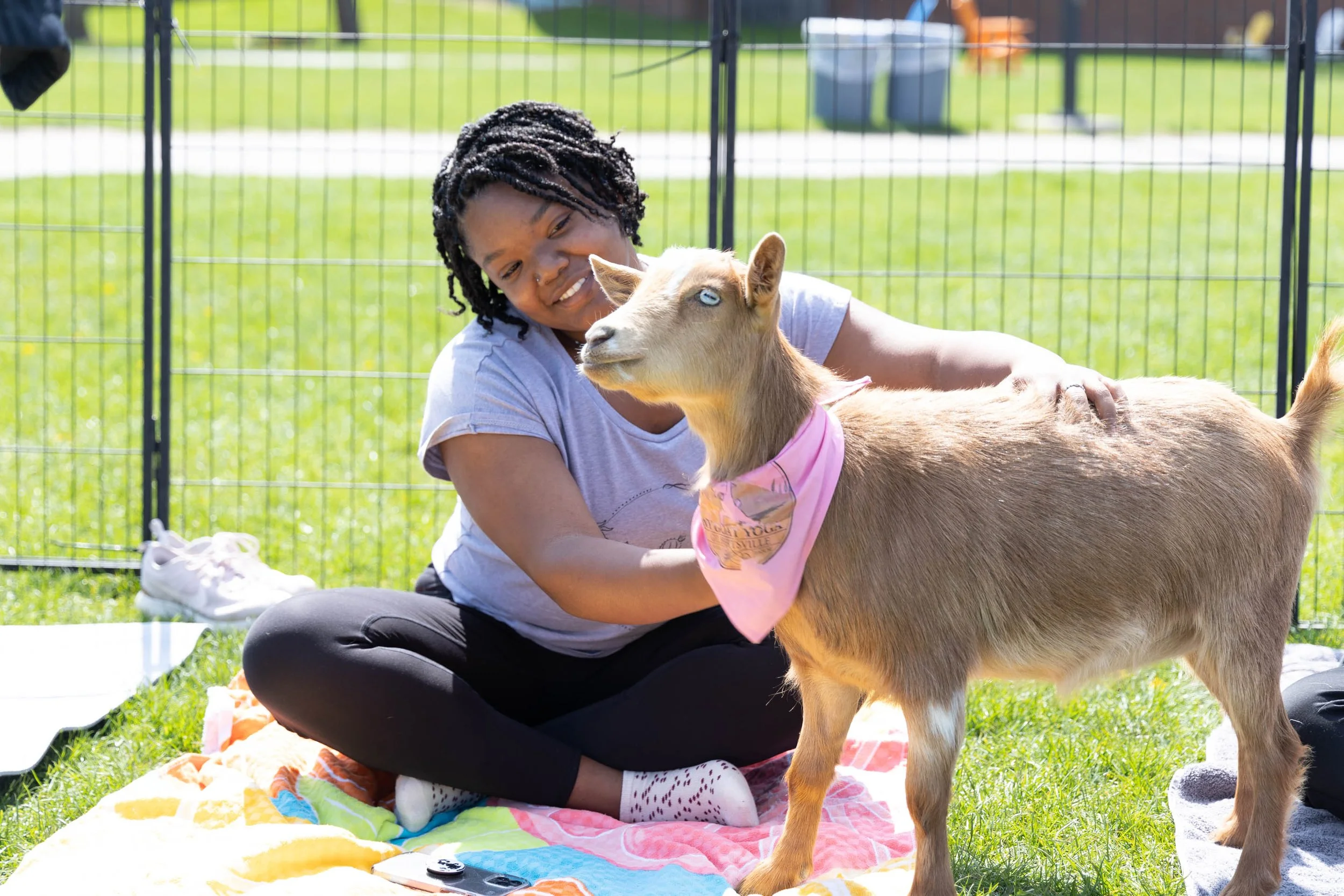 photo of  a woman asking is goat yoga ethical