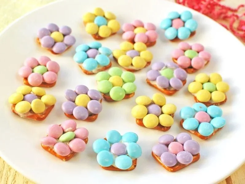 Plate of pretzels with pastel Easter candies
