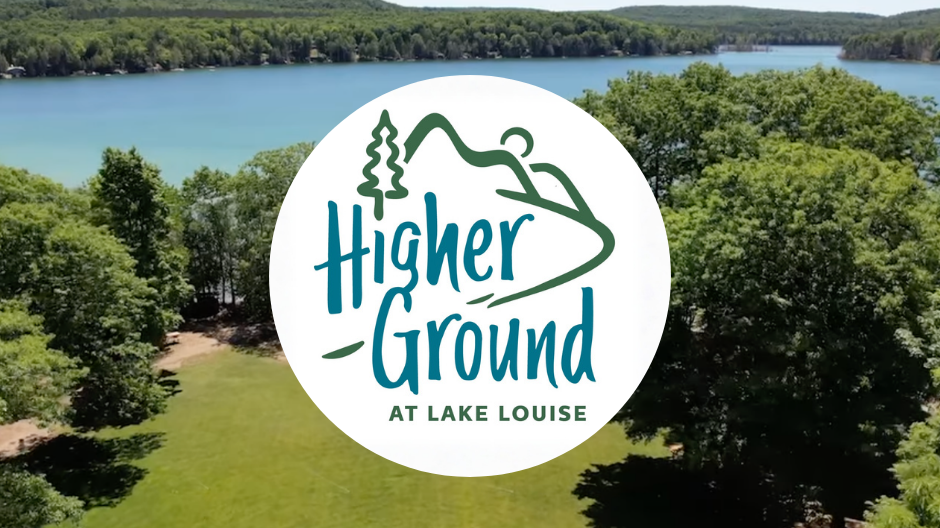 Higher Ground at Lake Louise logo on top of above view of camp