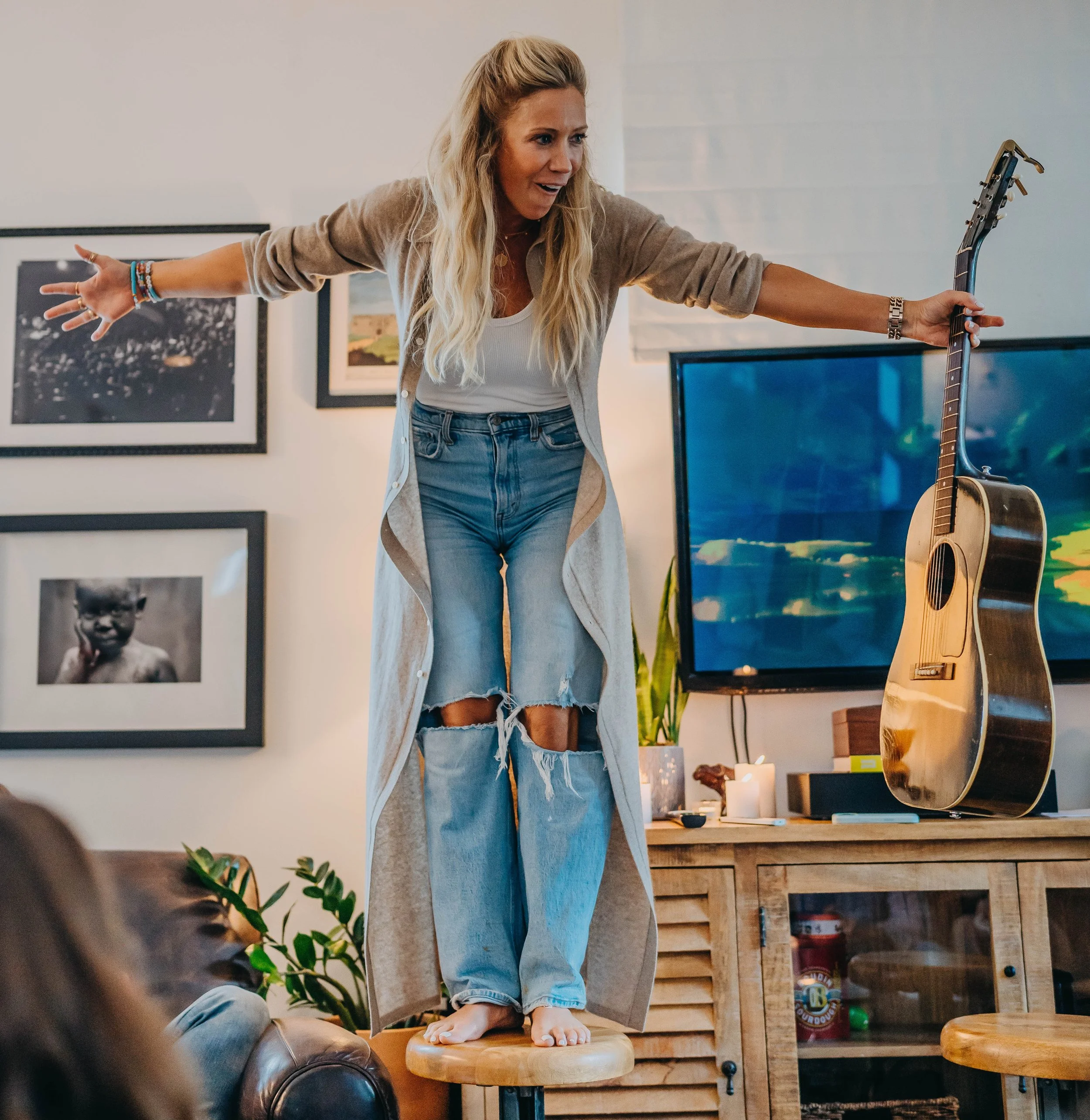 Ellie Holcomb holding her guitar
