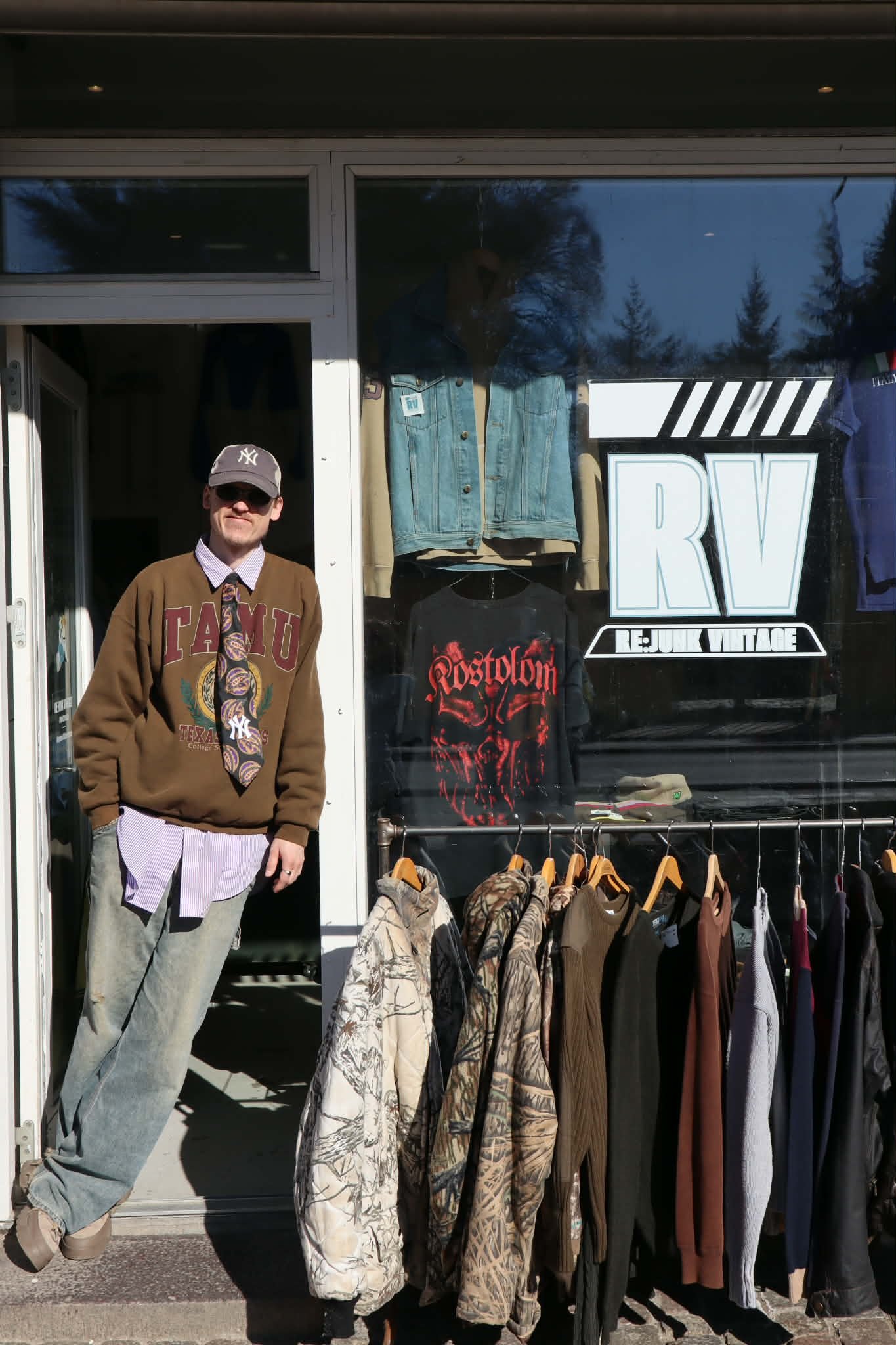 Owner of Re:Junk Vintage standing outside his secondhand and vintage shop in Copenhagen
