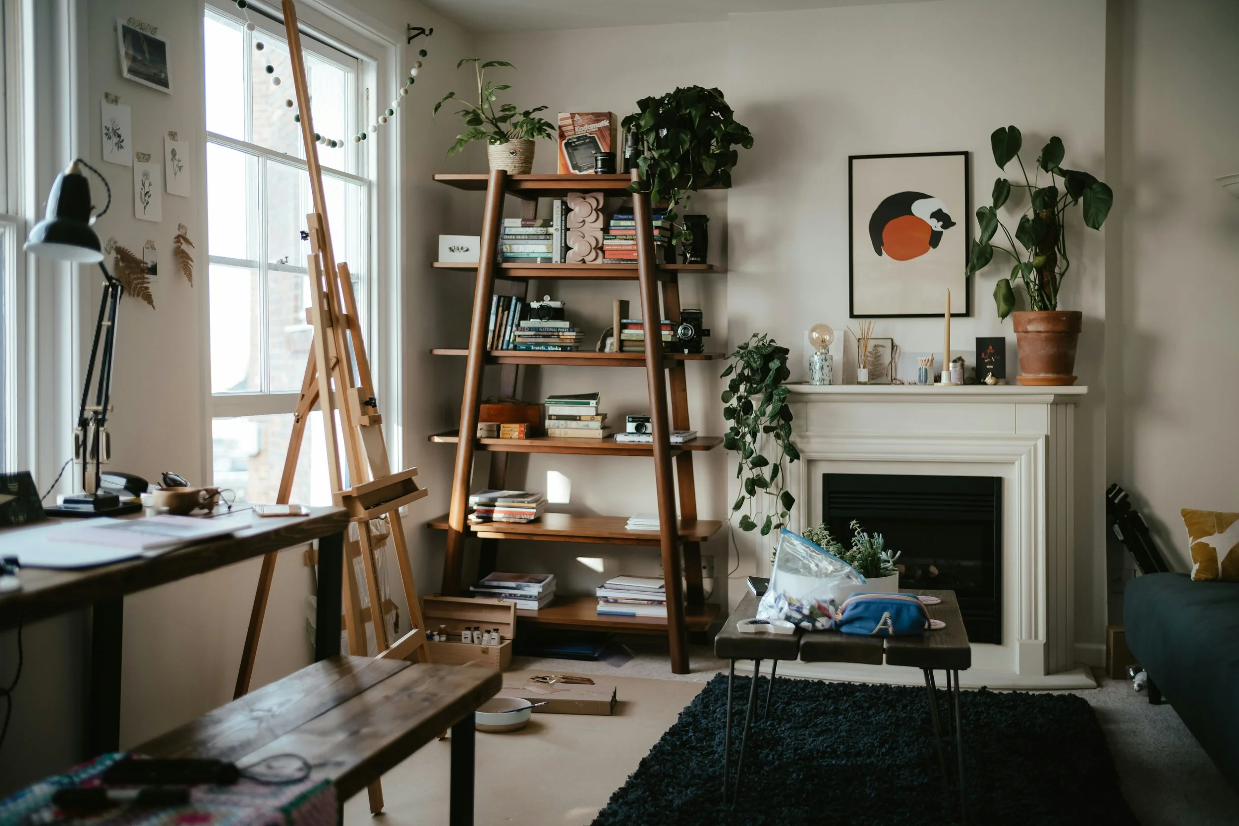 Cluttered living room with art supplies, books, and decor, Tumwater, Washington