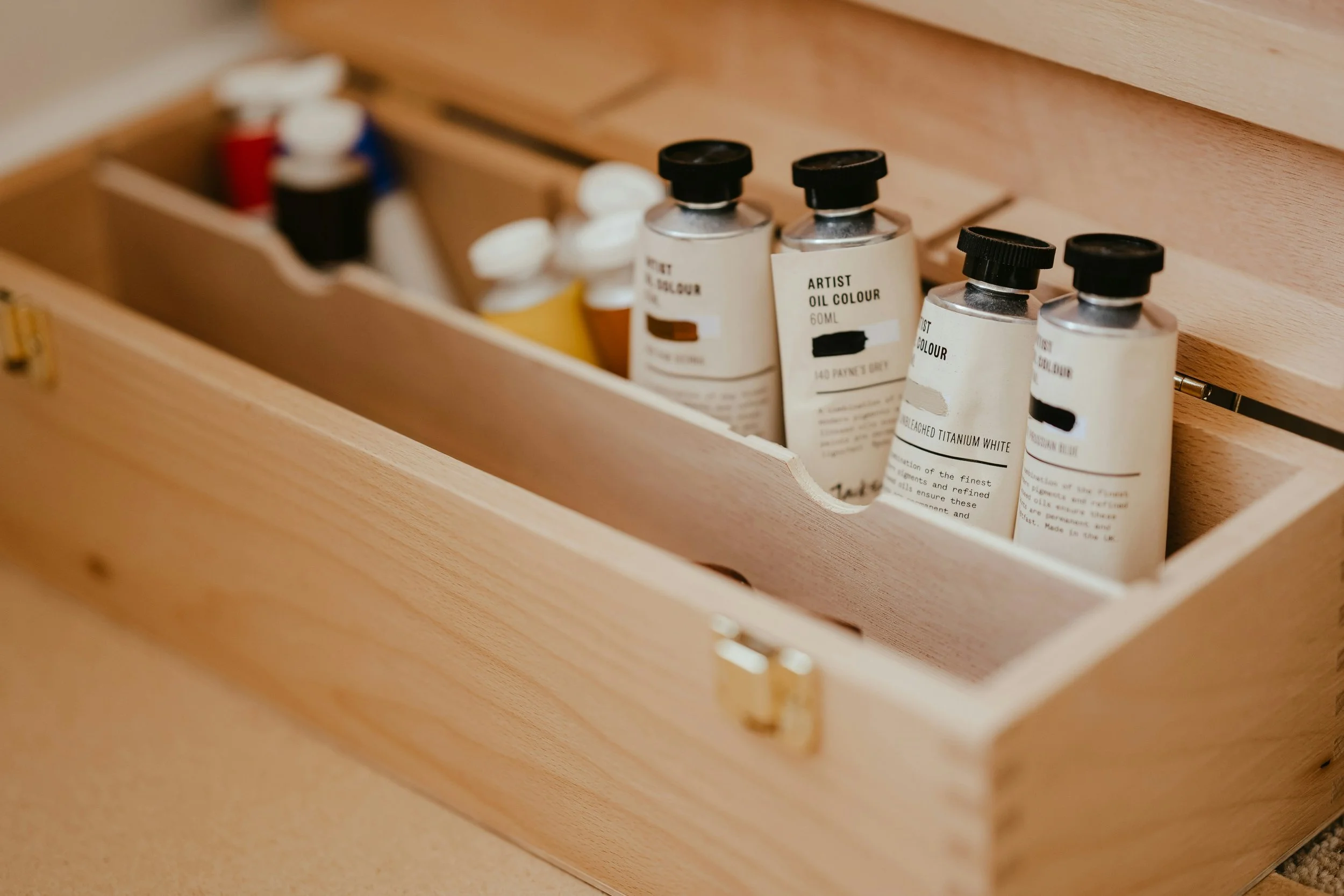 Tubes of artist paint organized in wooden box. Tumwater, Washington