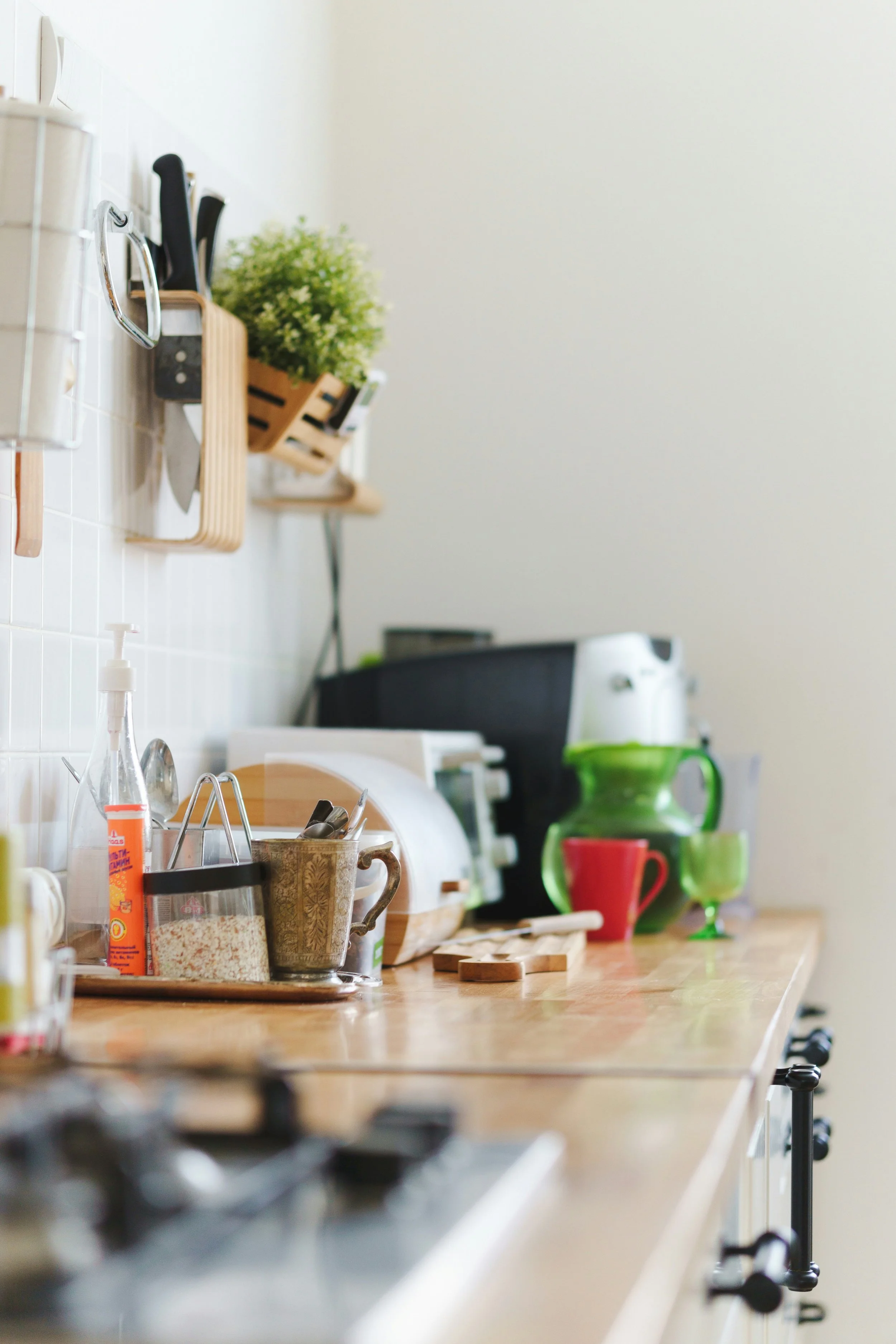 Kitchen counter transitioning from clutter to an intentional space through professional home organizing in Lewis County, Washington