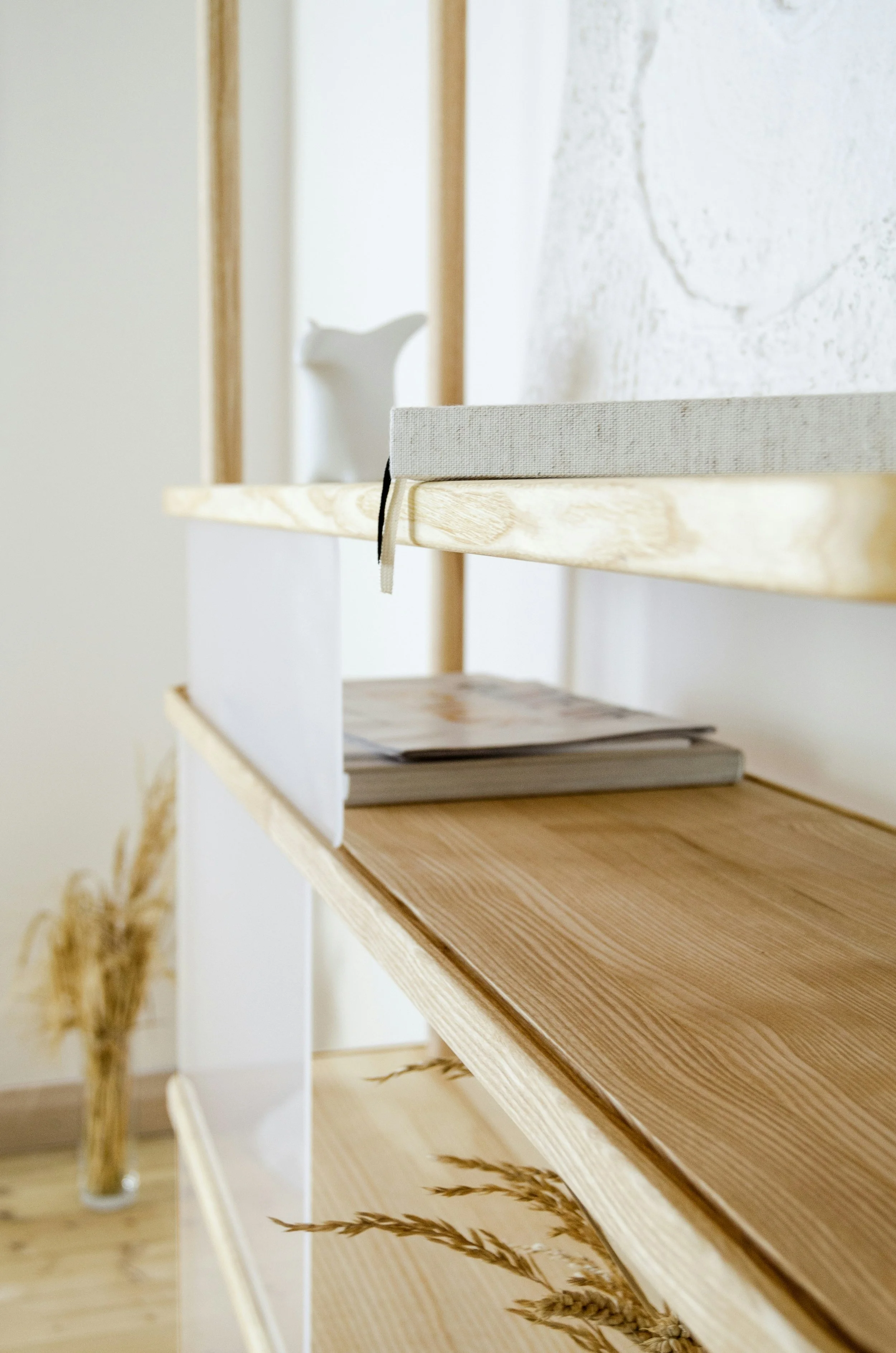 A minimalist shelf with books and open space representing a KonMari tidying festival by an Olympia, WA home organizer