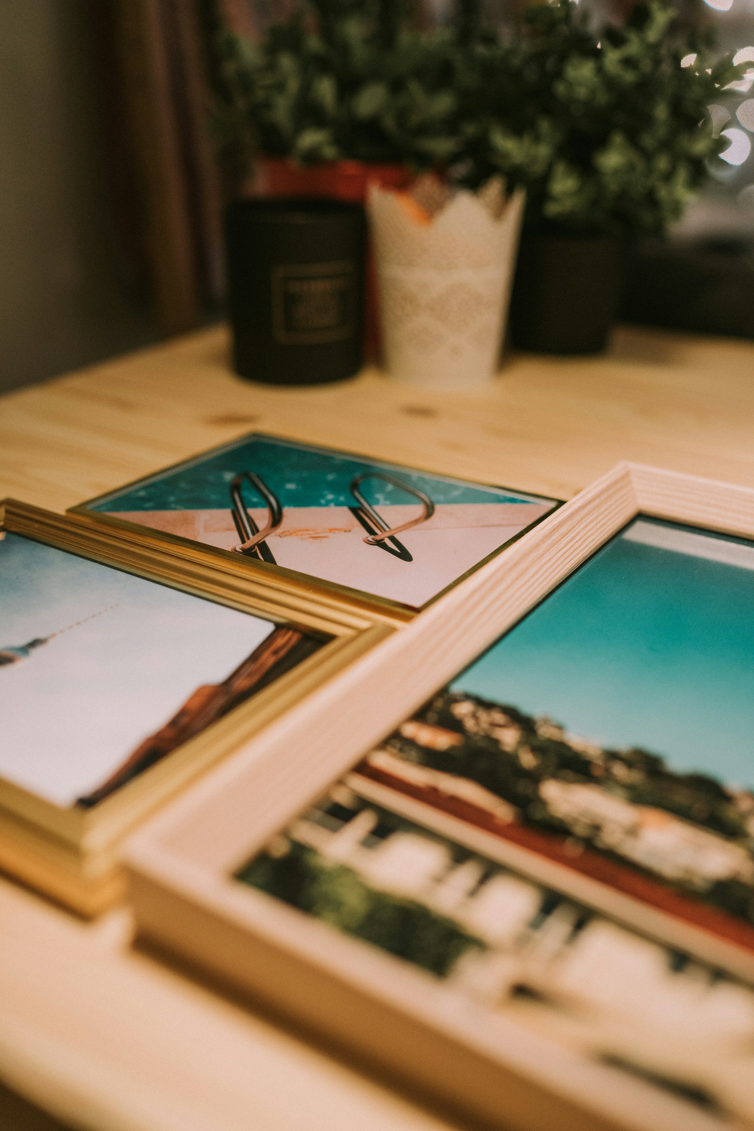 Framed family heritage photos on a table, representing senior rightsizing and aging in place services by a Certified KonMari Consultant in Tumwater, WA