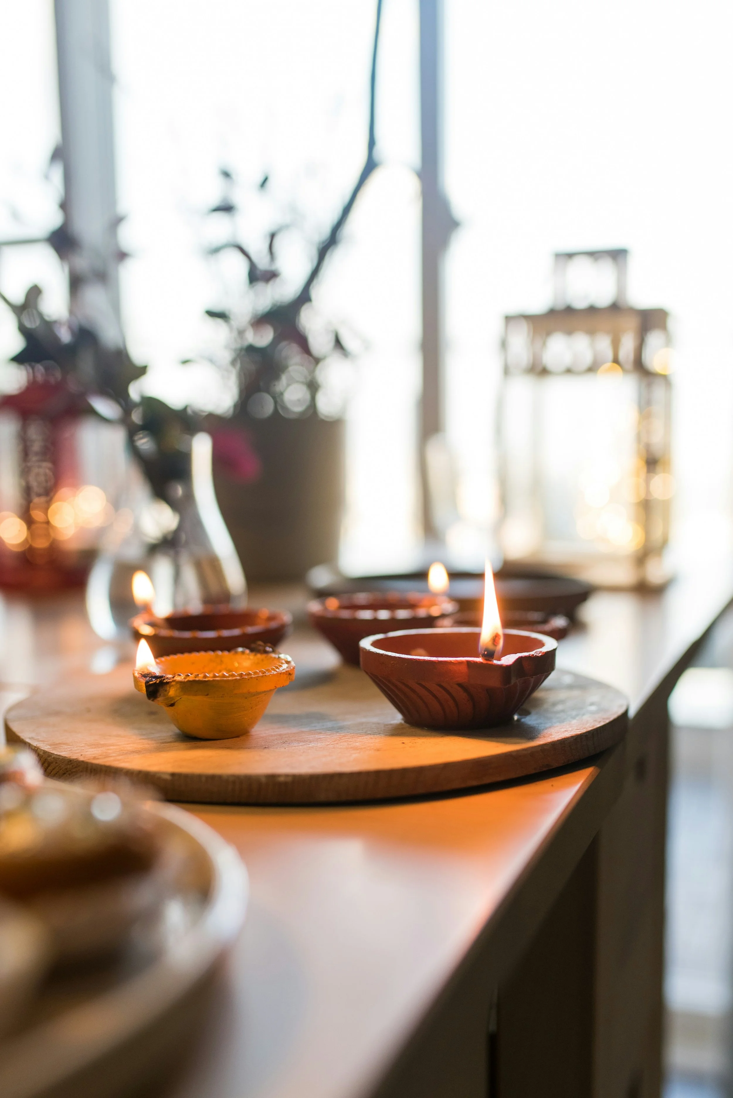 Diwali lights and decor organized on a table for sustainable holiday decorating. East Olympia, Washington