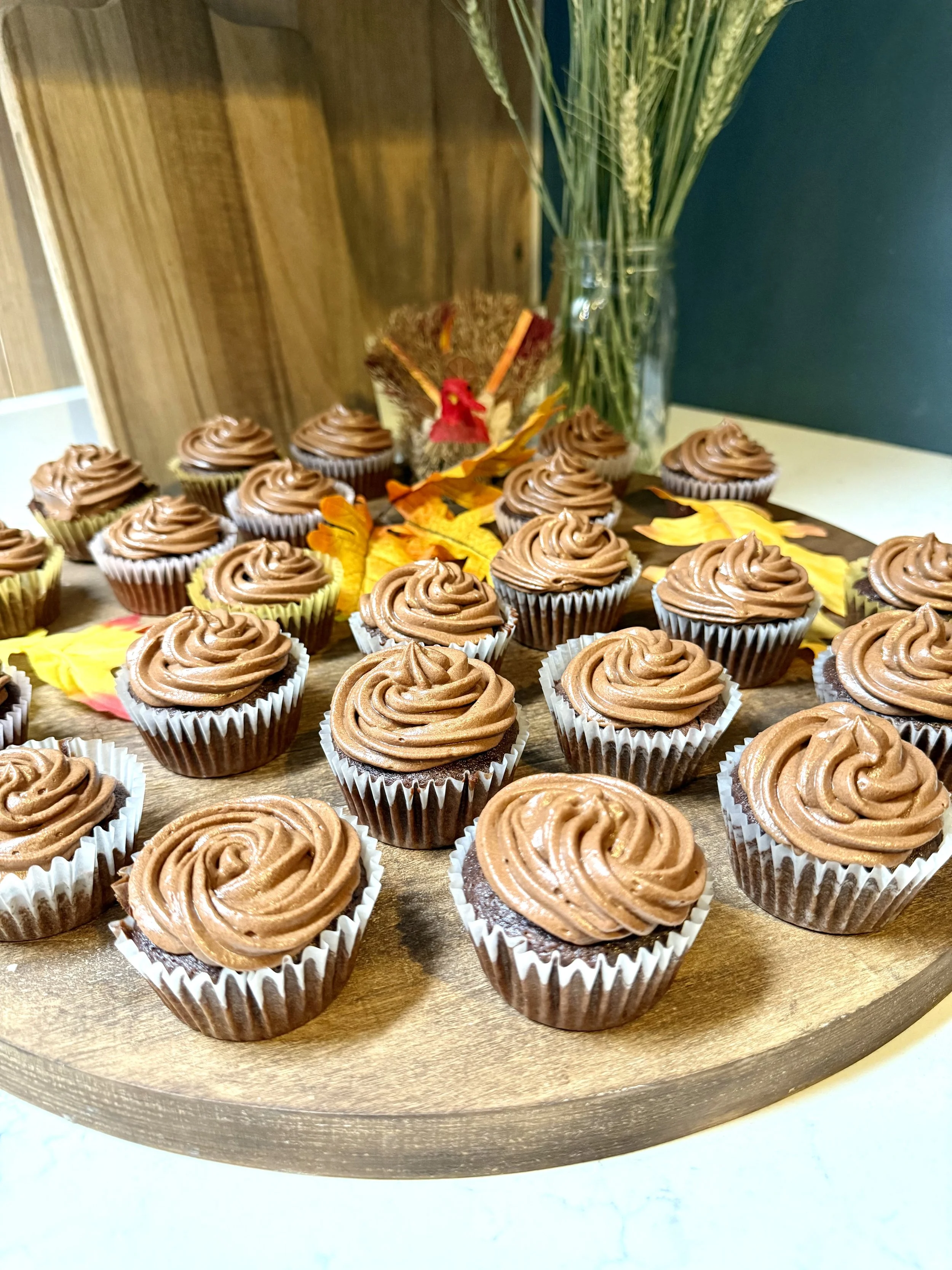 Rich chocolate cupcakes ready to decorate like little turkeys--these are the perfect kid Thanksgiving dessert.