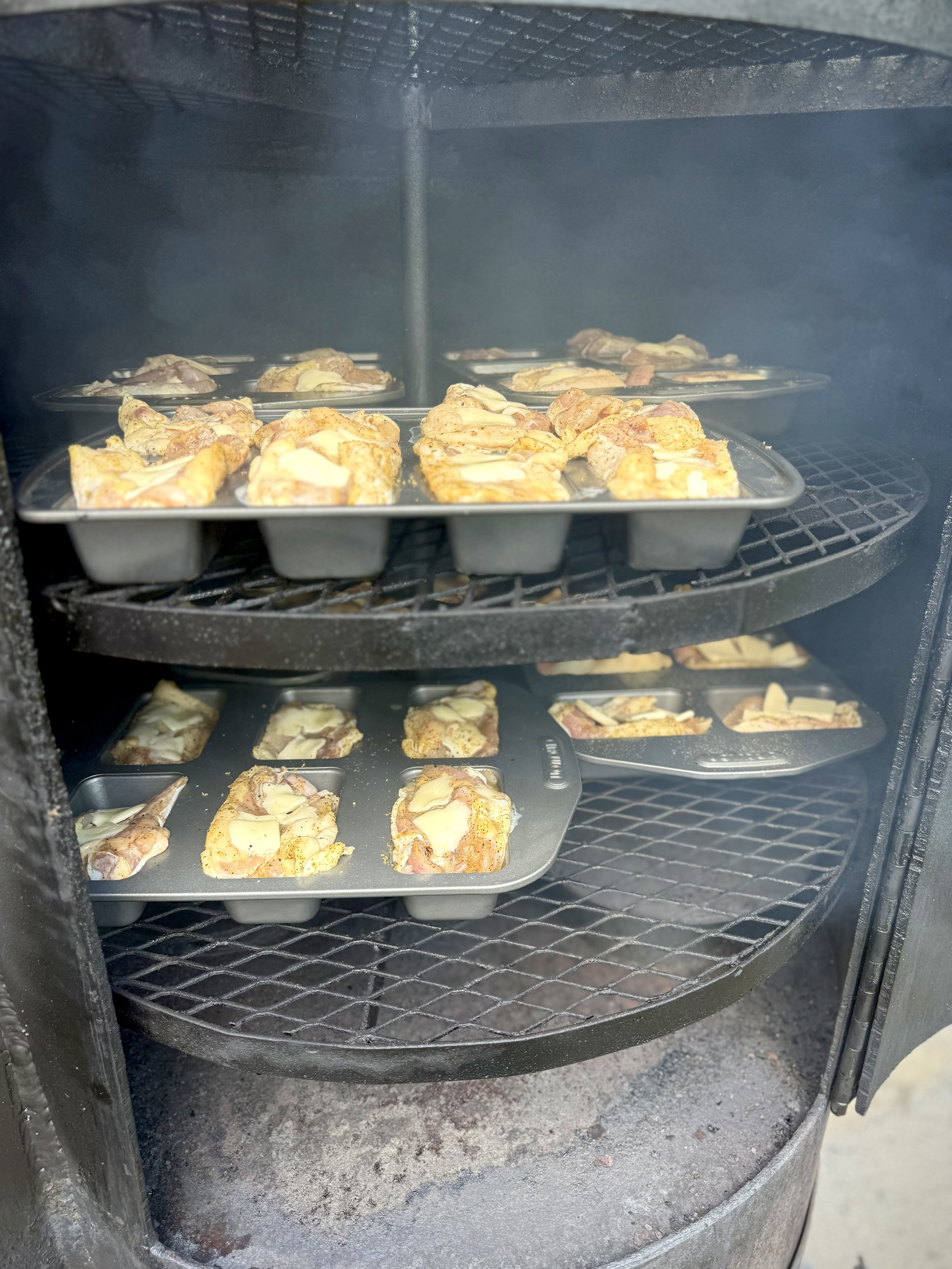 Chicken thighs trimmed perfectly for competition BBQ smoking in hickory wood low and slow for perfect, juicy smoked and grilled chicken.