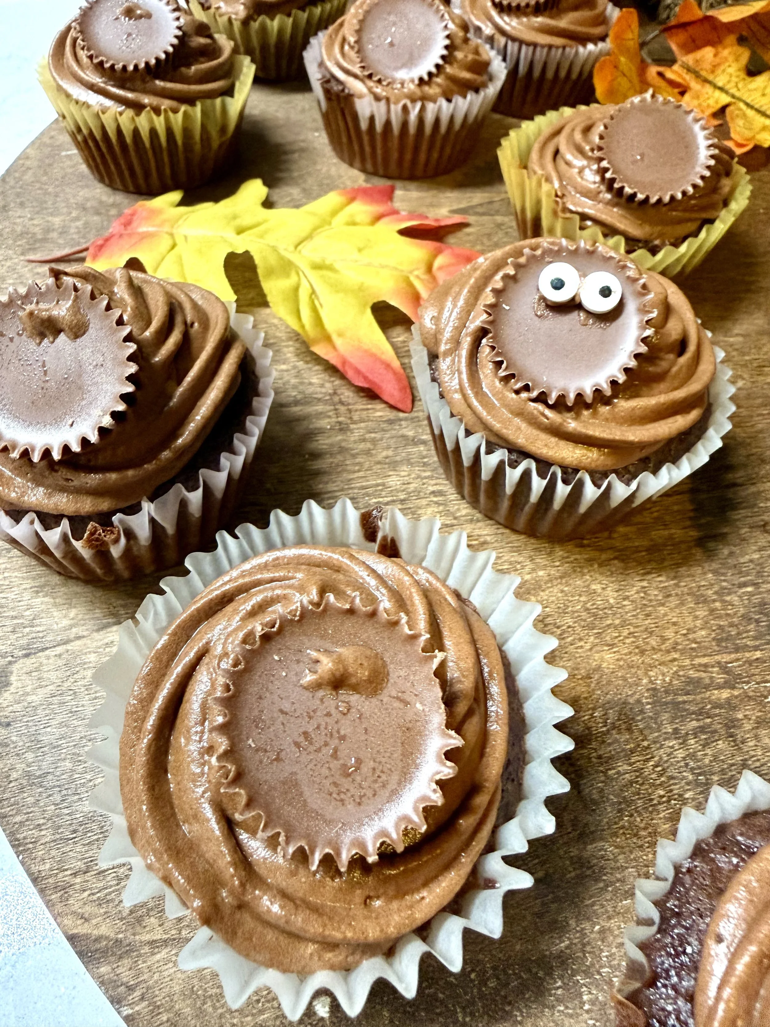 Decorating the moist chocolate cupcakes to look like cute little turkeys.
