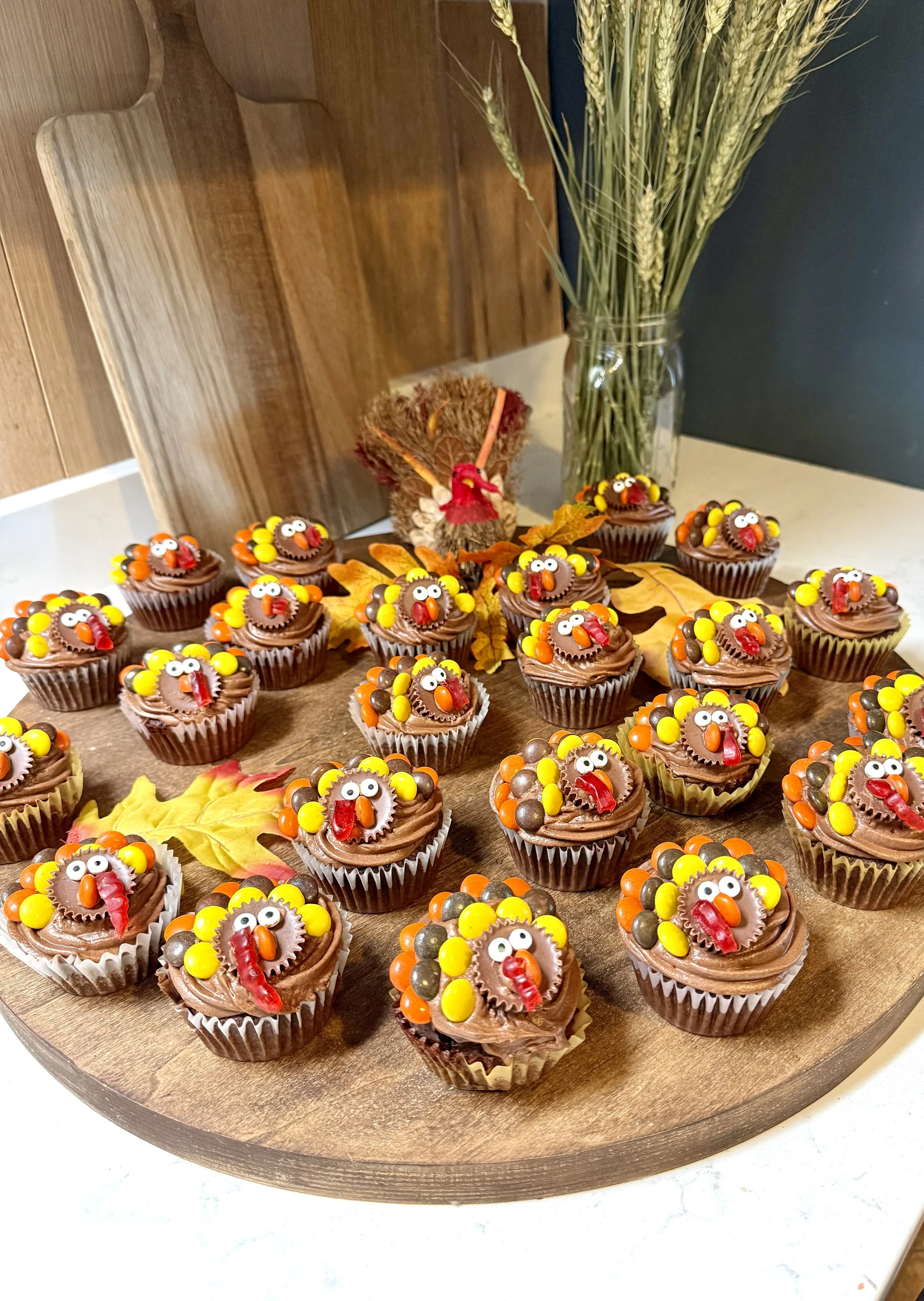 A platter full of super cute Thanksgiving chocolate turkey cupcakes