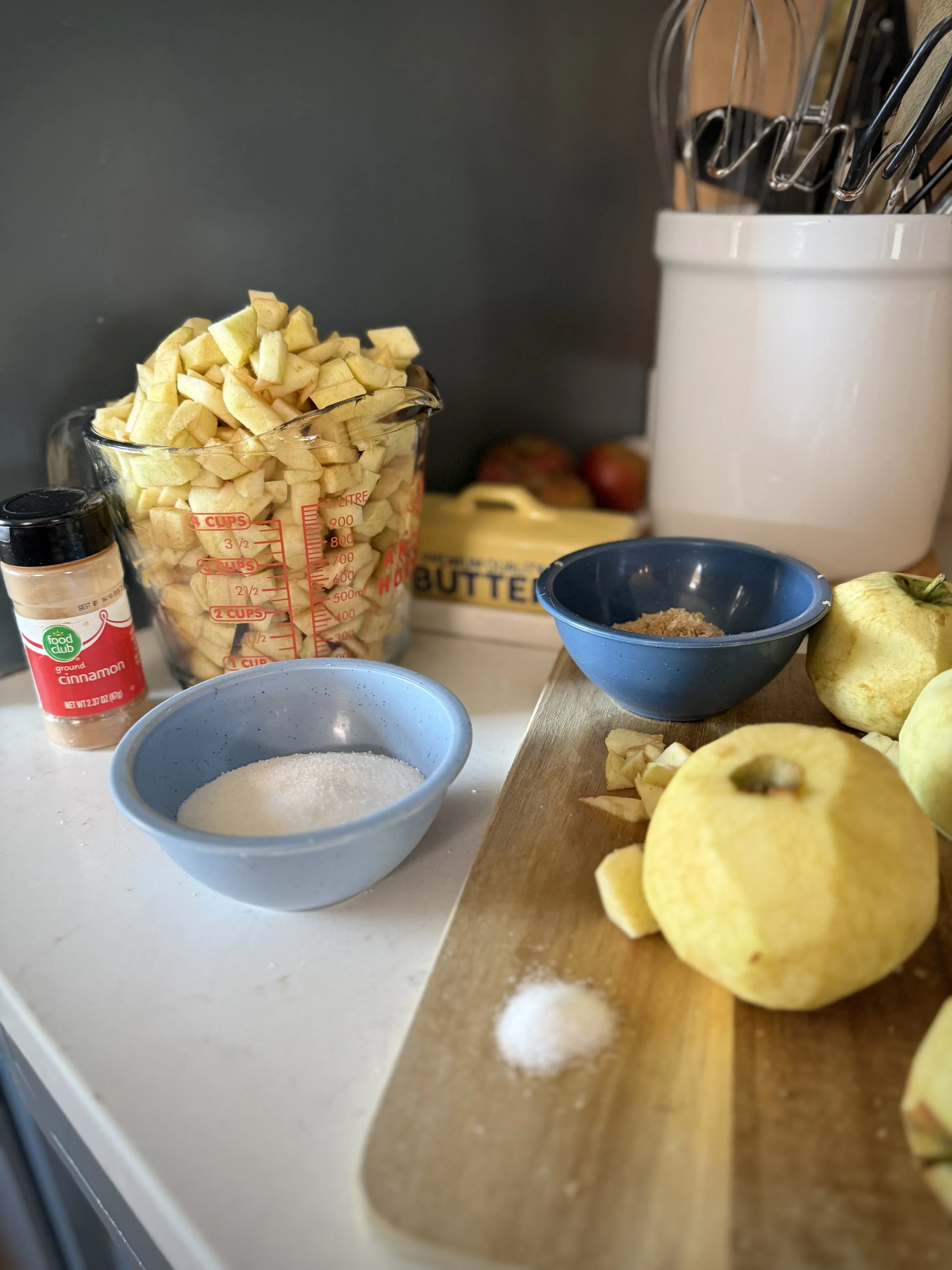 chopped apples ready to cook down in a cast iron skillet for fried apple pies