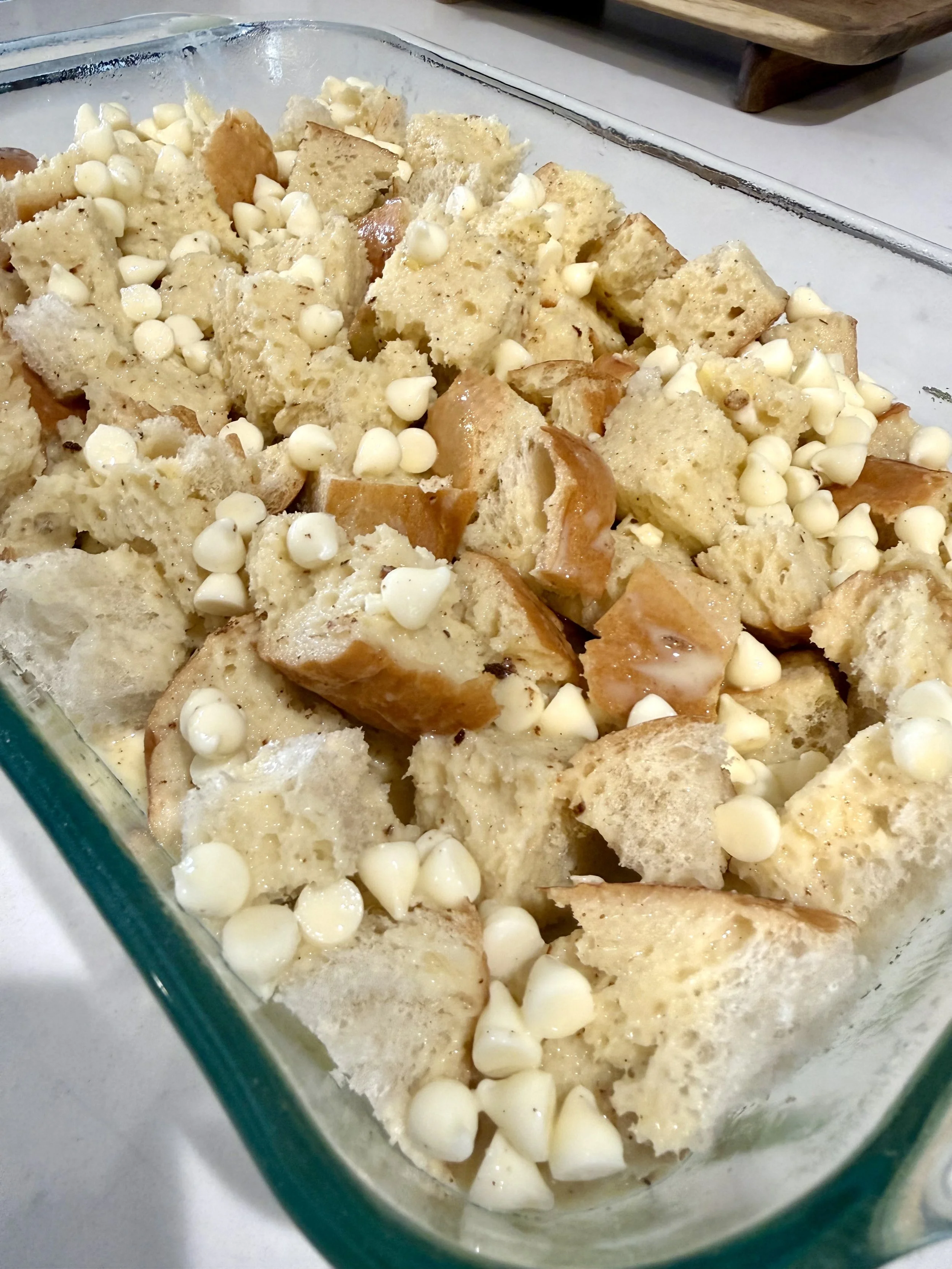 Close up shot of eggnog bread pudding before it goes into oven.