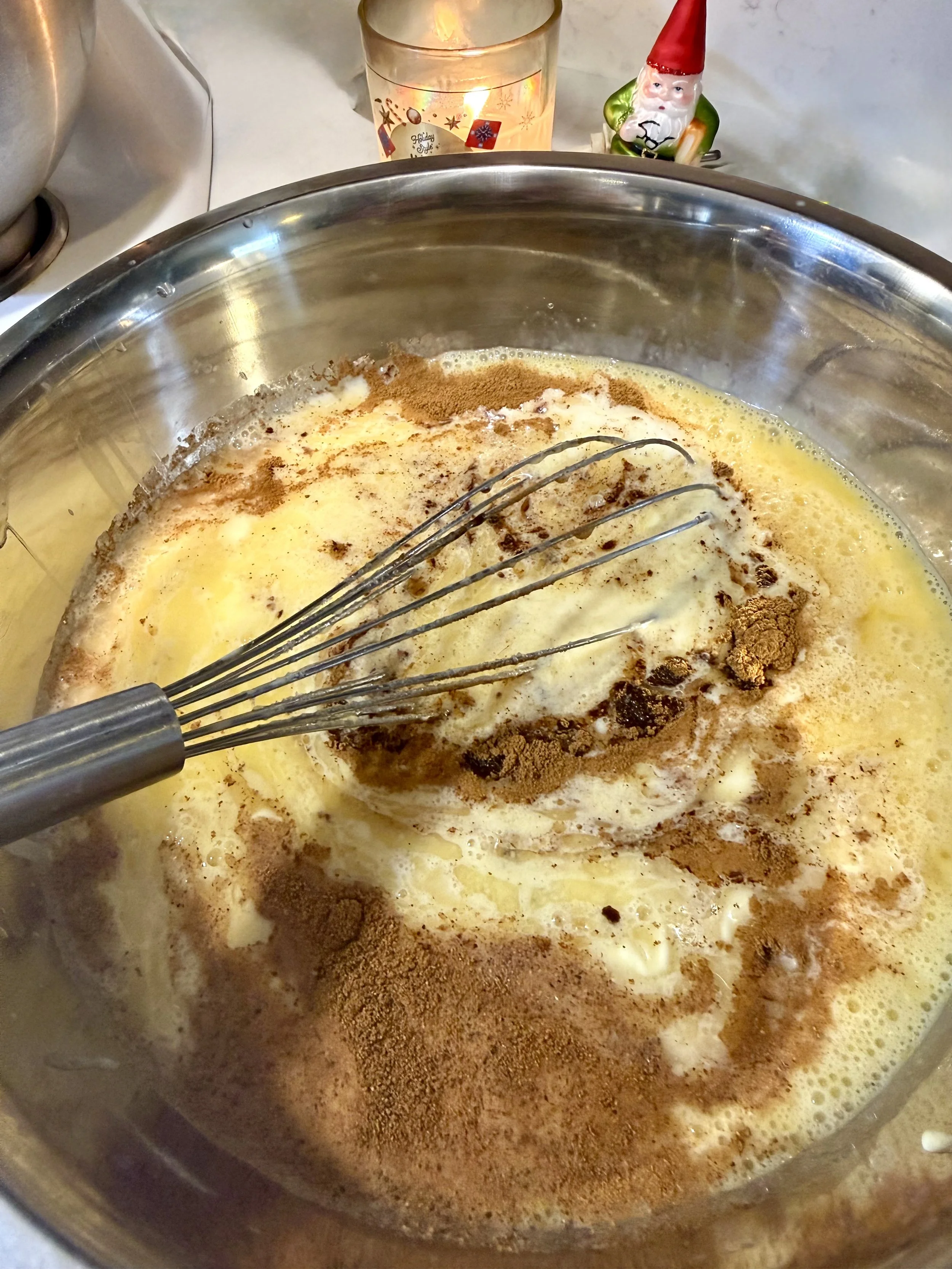 Warm and cozy holiday spiced custard for Eggnog Bread Pudding Recipe with Holiday Rum Sauce.