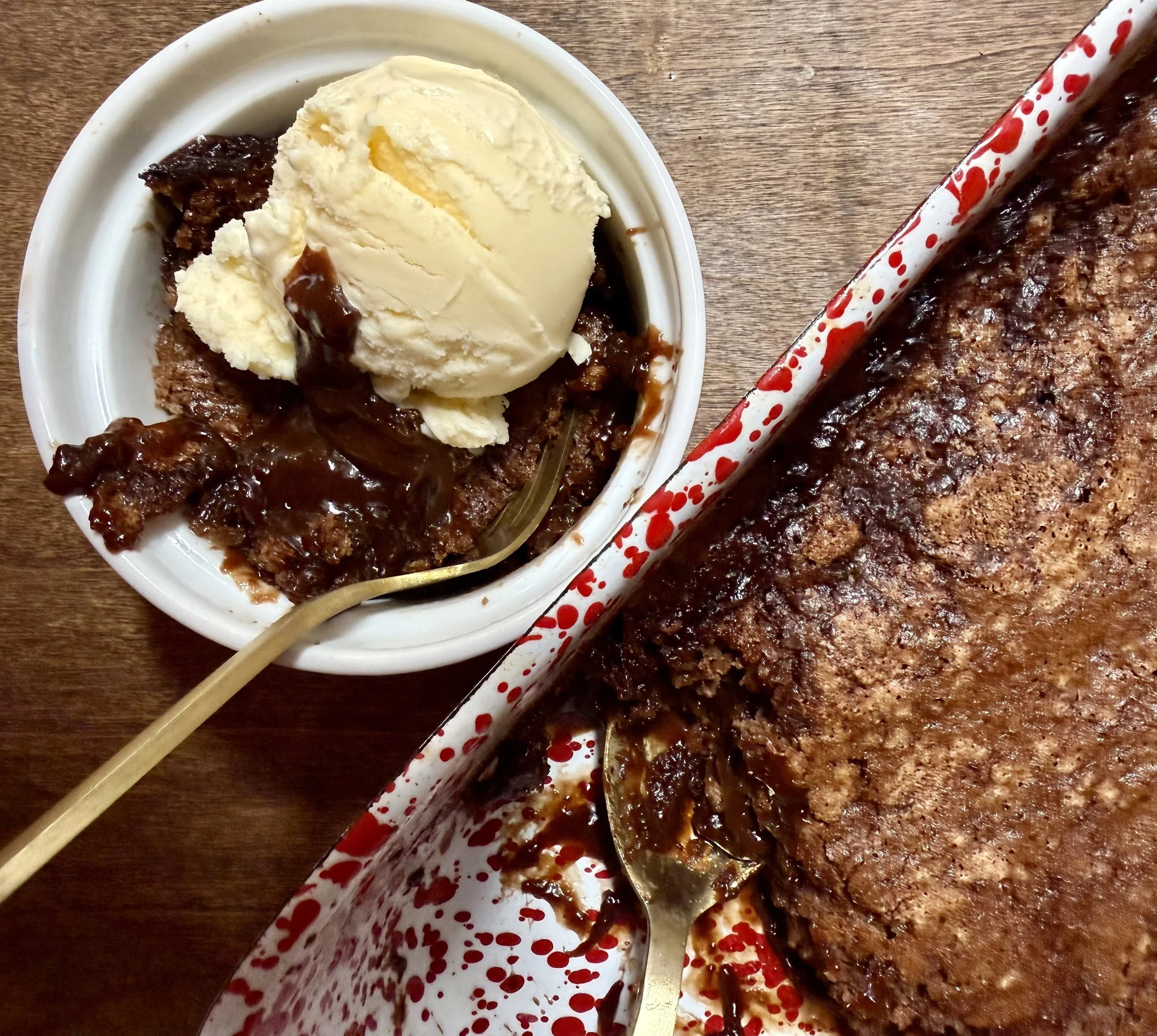 Southern chocolate cobbler with a big scoop of blue bell homemade vanilla ice cream is the perfect Southern desserts for cozy cold weather nights when a chocolate craving hits.