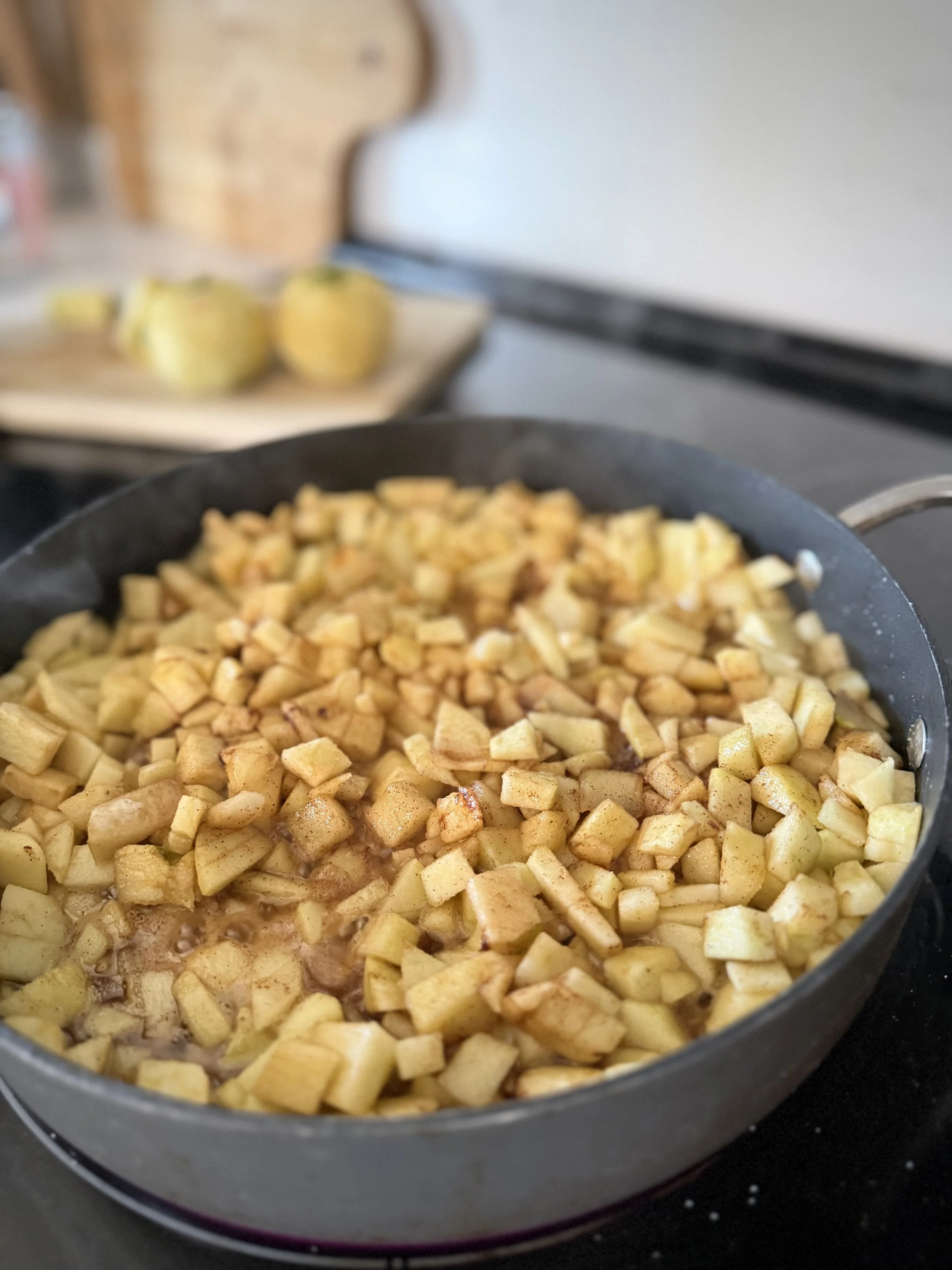 Fresh apples-gala, Jonathan, grannysmith-simmmering in a pan on the stove in fall for grandma's Southern fried apple pies