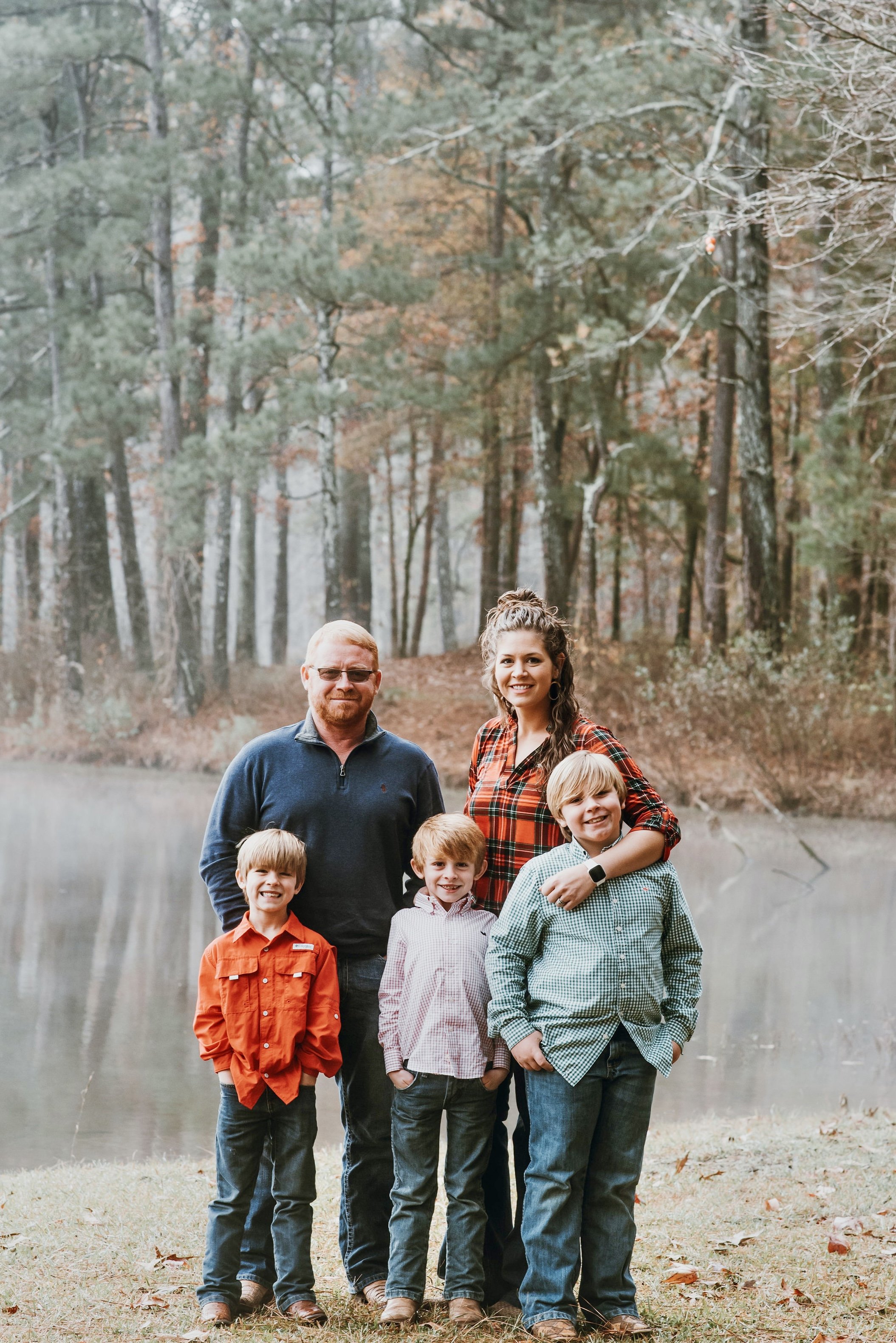 Glover family from Crooked Creek Ranch Life blog in pine trees in Central Alabama.