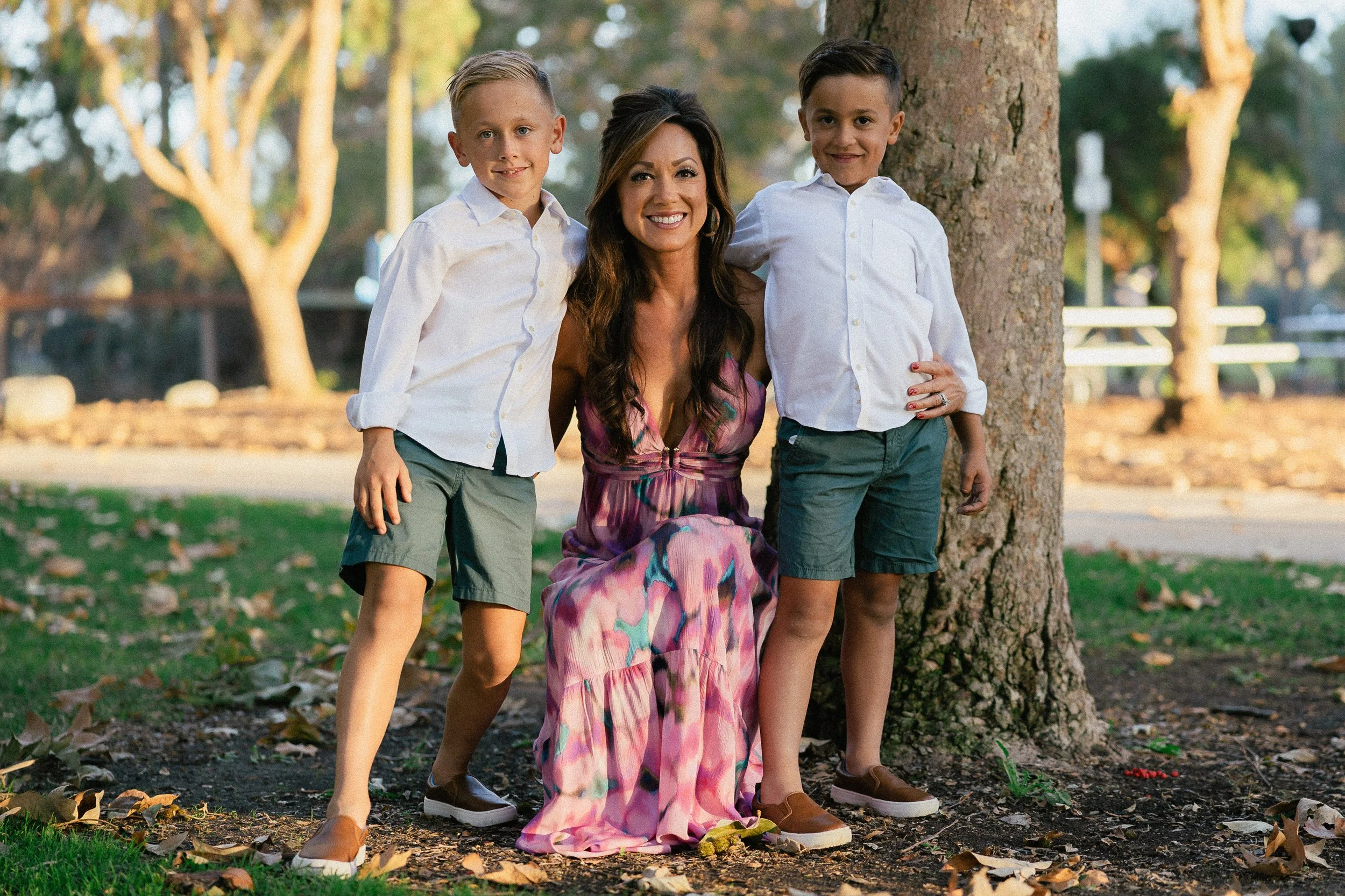 Mom kneeling between her two sons during a family session at Turtle Rock Park in Irvine.