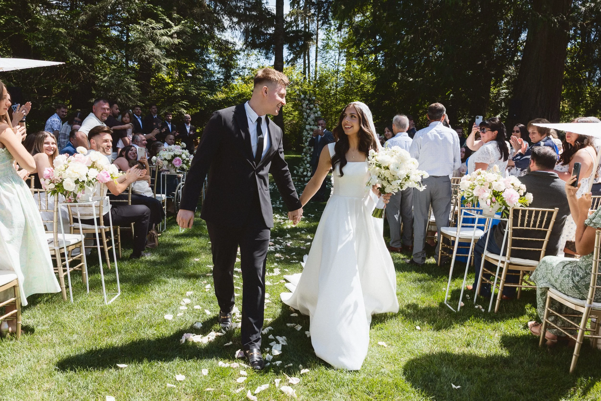 Bride and groom walk back down the aisle at The Hidden Stone Venue in Bonney Lake, Washington.