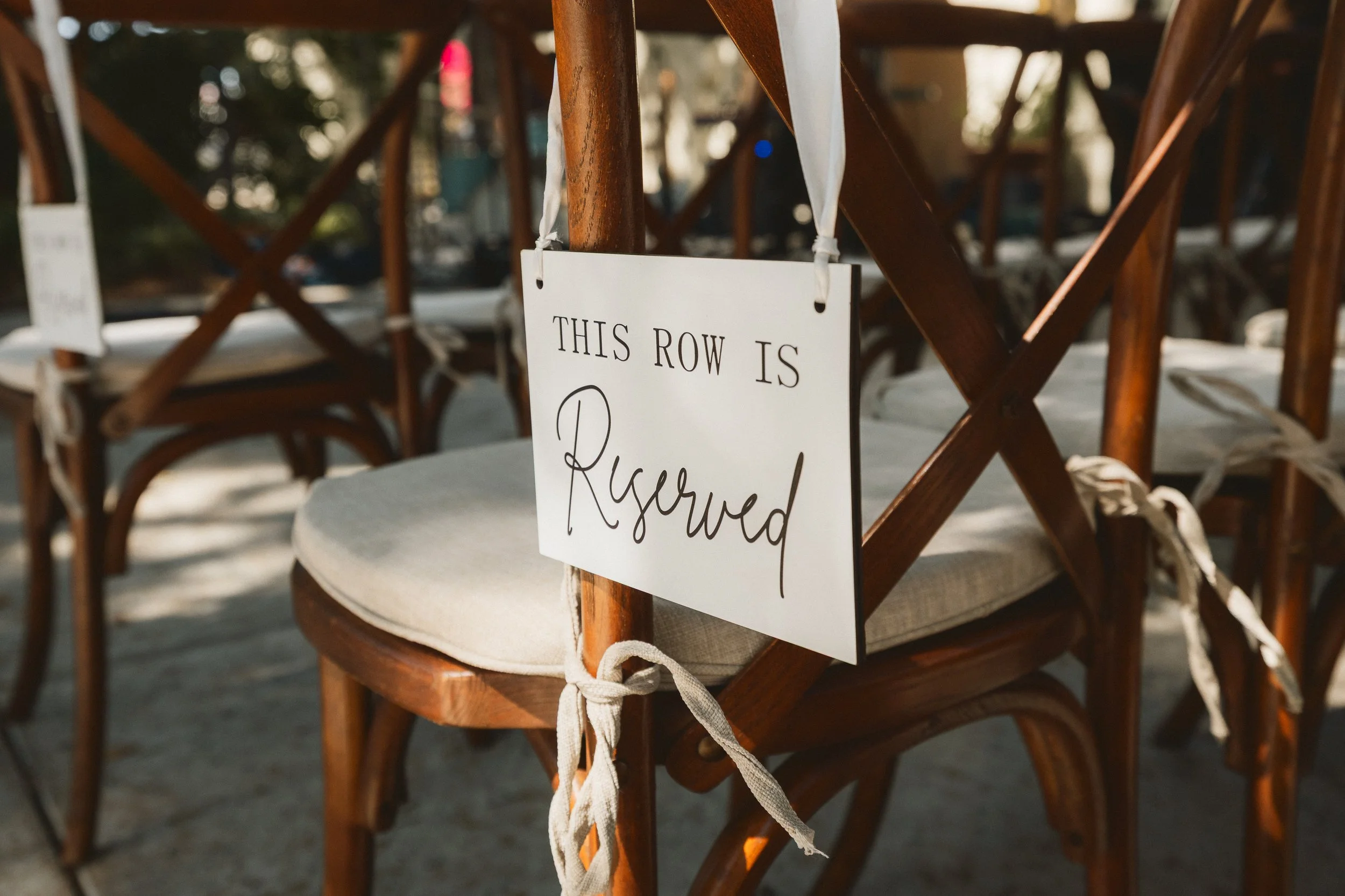 Reserved row sign on wedding ceremony chairs at Los Angeles River Center