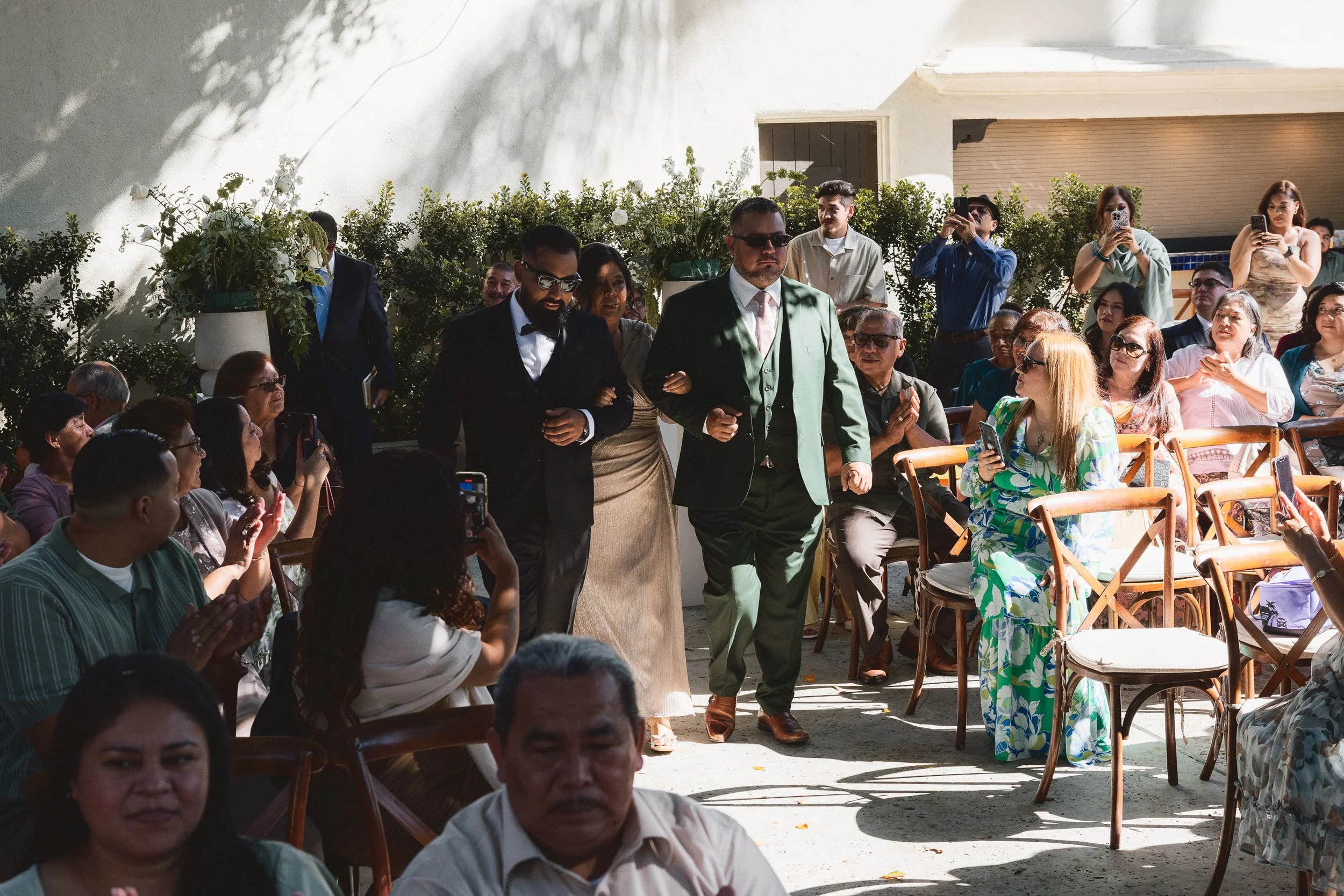 Family members walking down the aisle during ceremony processional