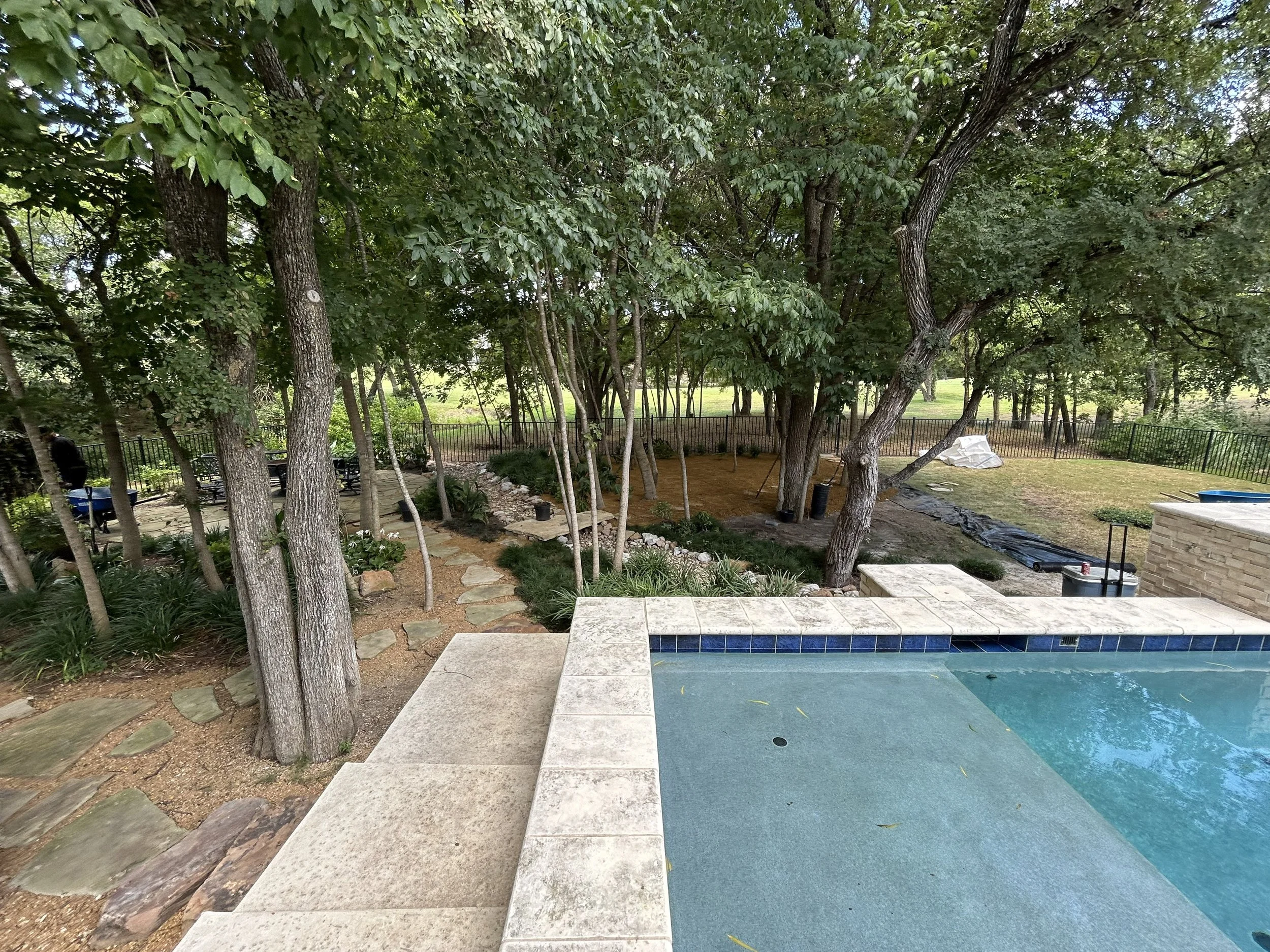 Photo showing how the new landscape installation relates to the existing pool