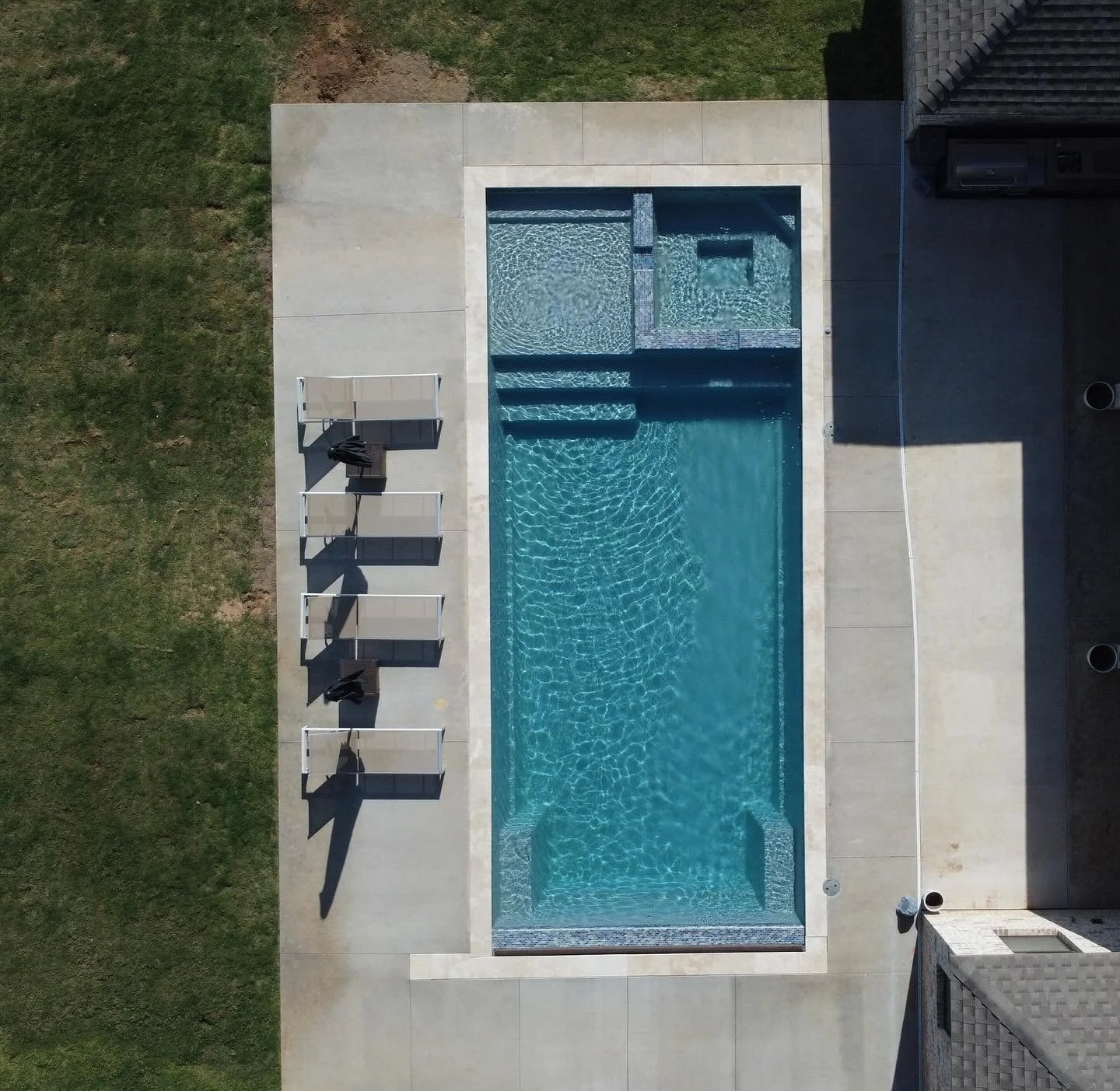 16x36 with integrated spa ivory coping.jpg